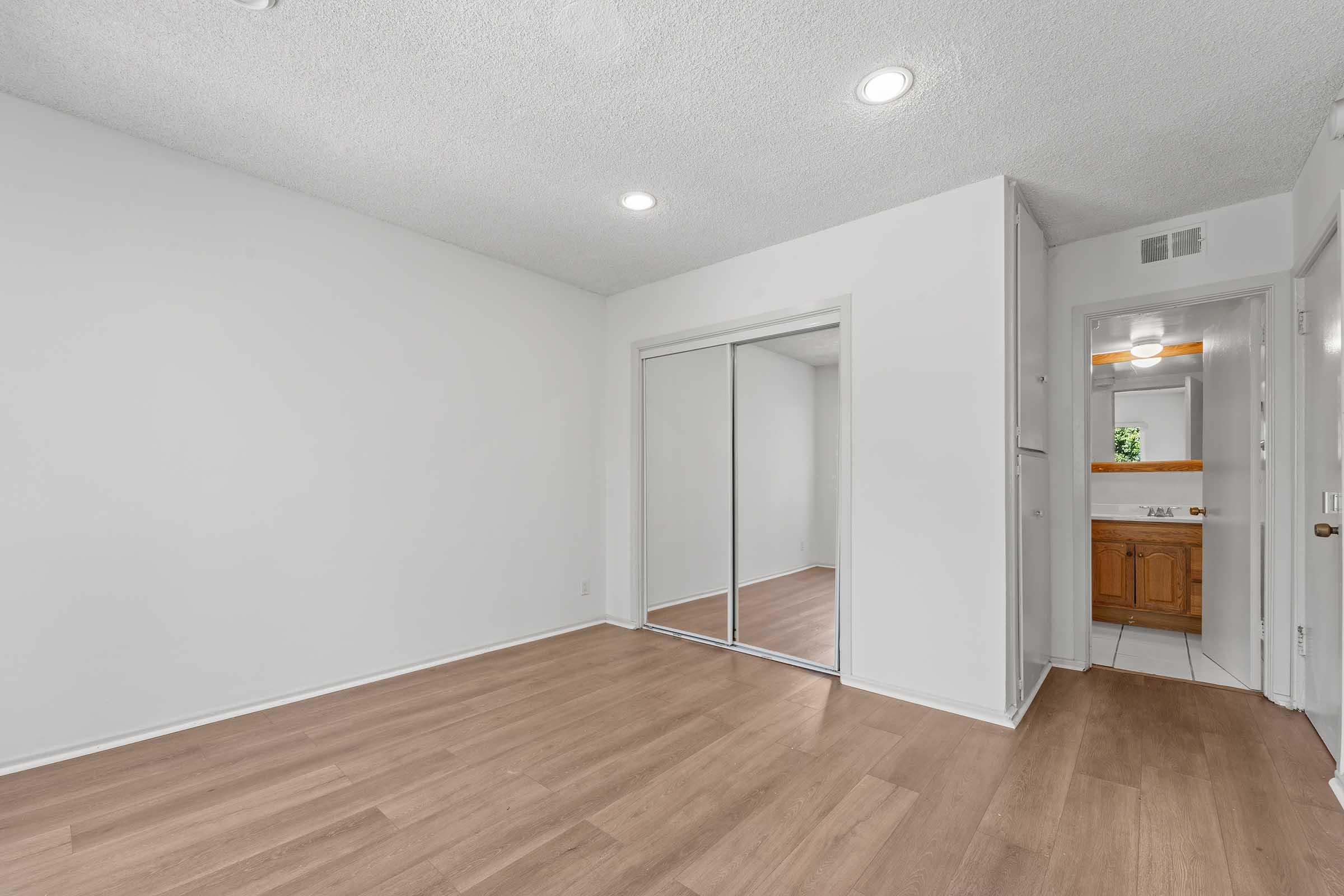 a kitchen with a wood floor