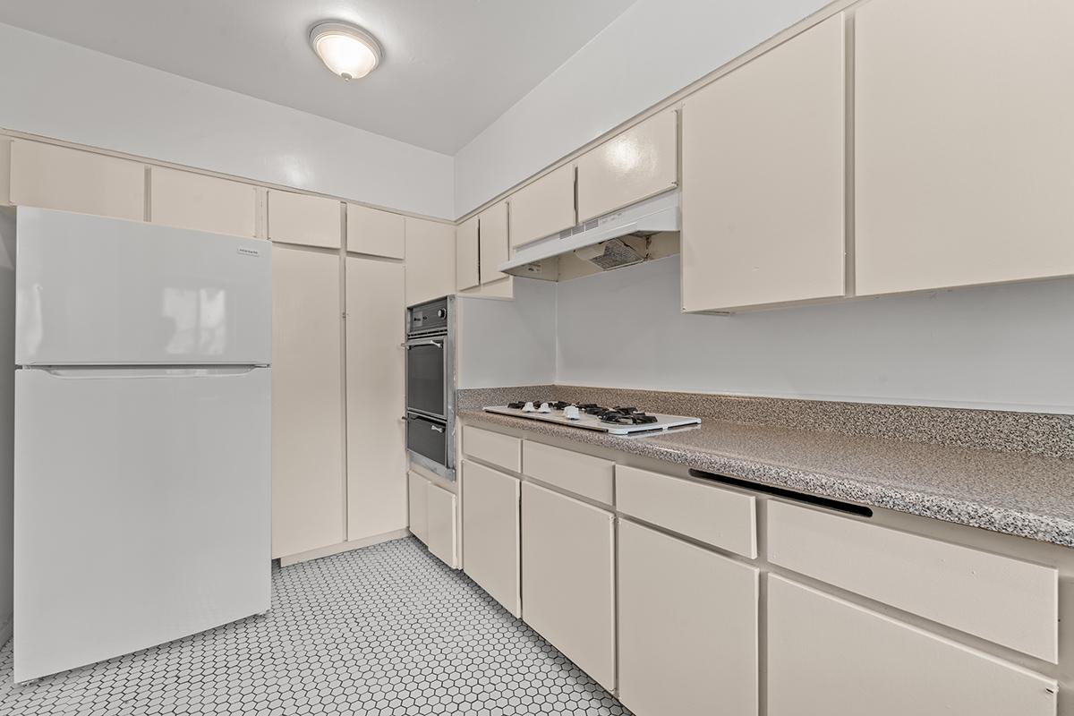 a kitchen with a sink and a refrigerator