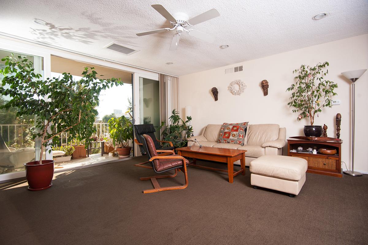 a living room filled with furniture and a fireplace