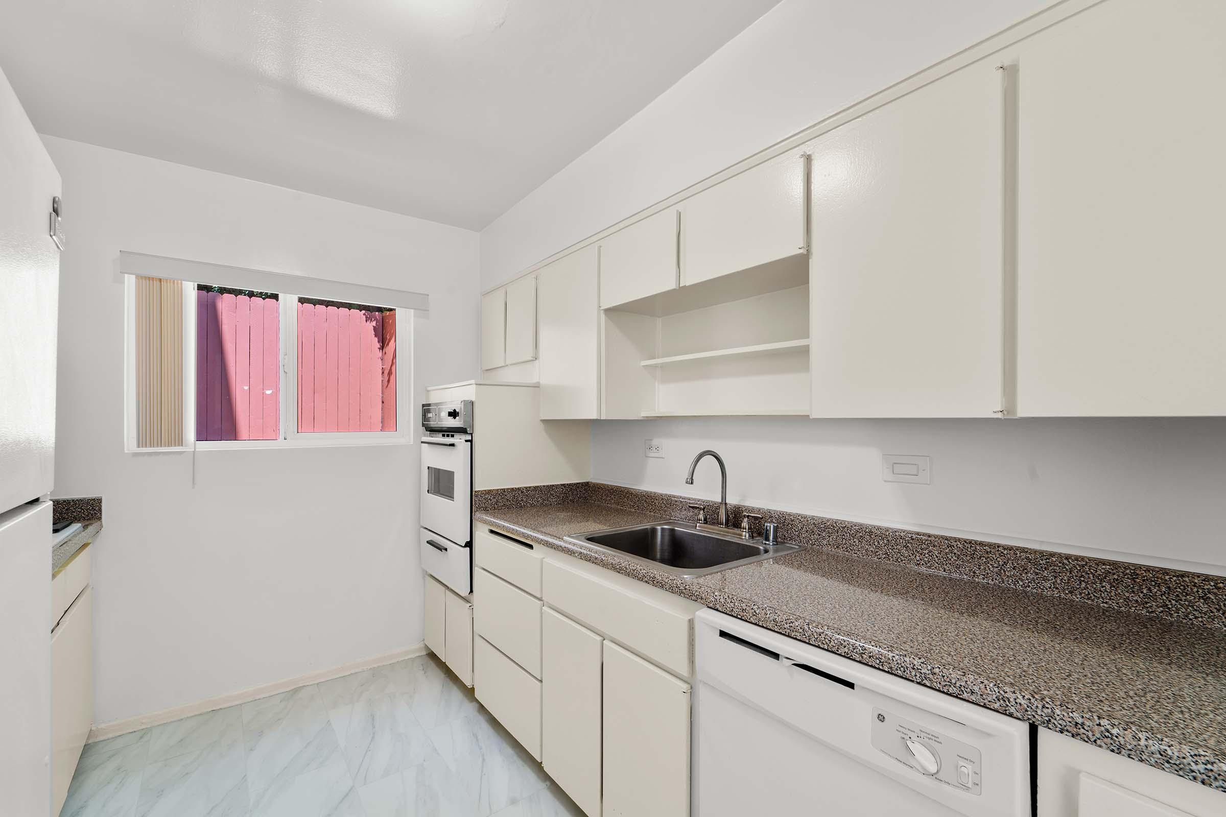 a kitchen with a stove and a sink