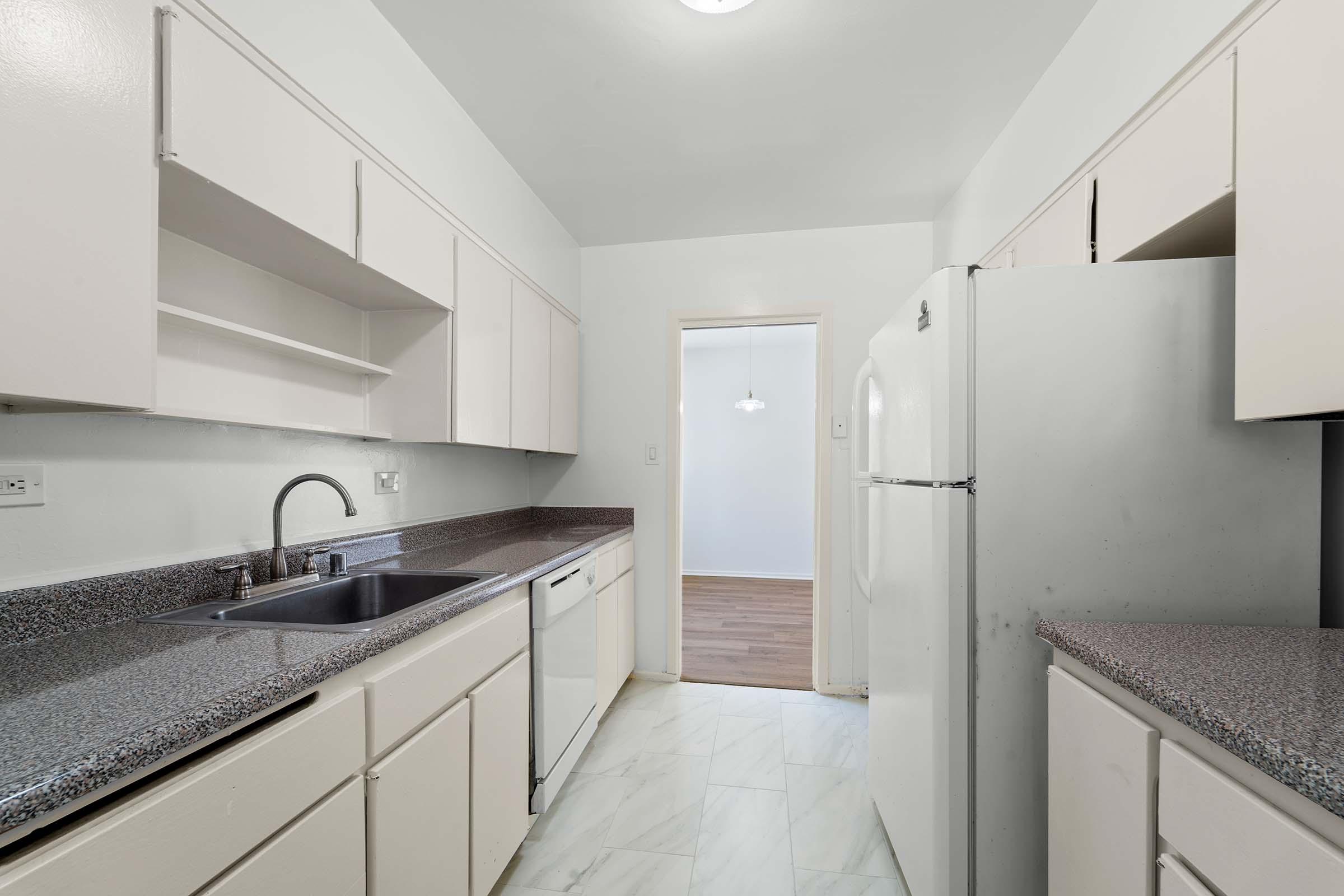 a kitchen with a stove and a sink