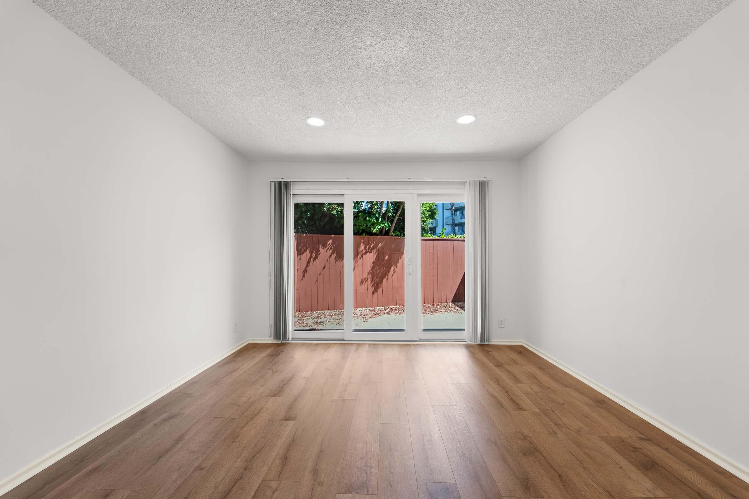 a large empty room with a wooden floor