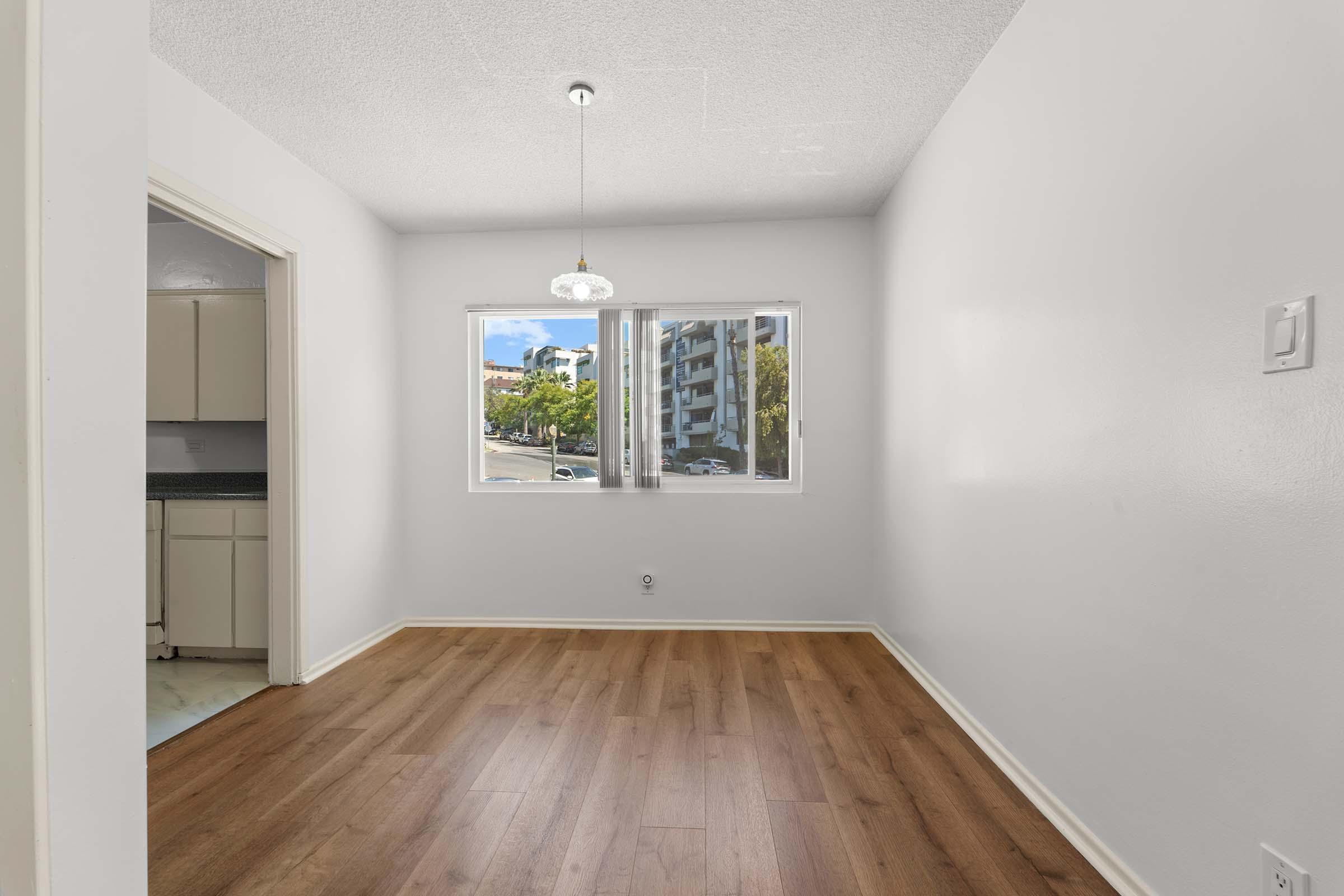 a large empty room with a wood floor