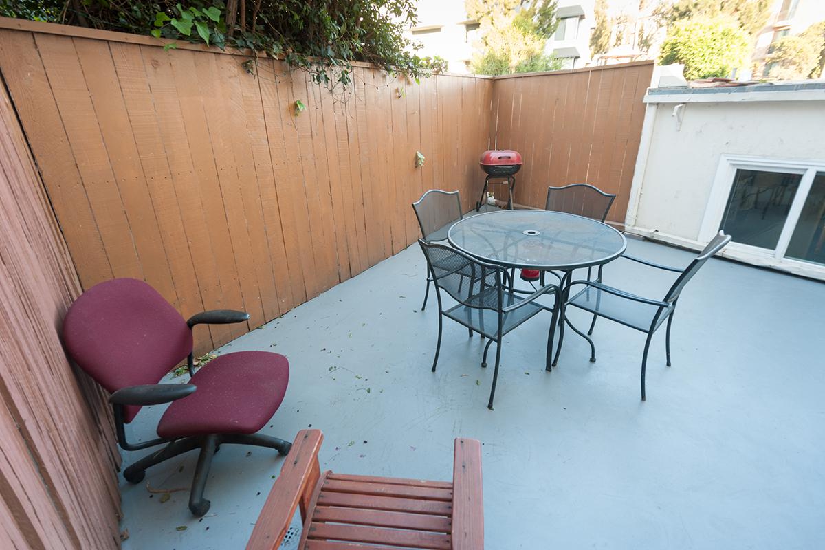 a chair sitting in front of a house