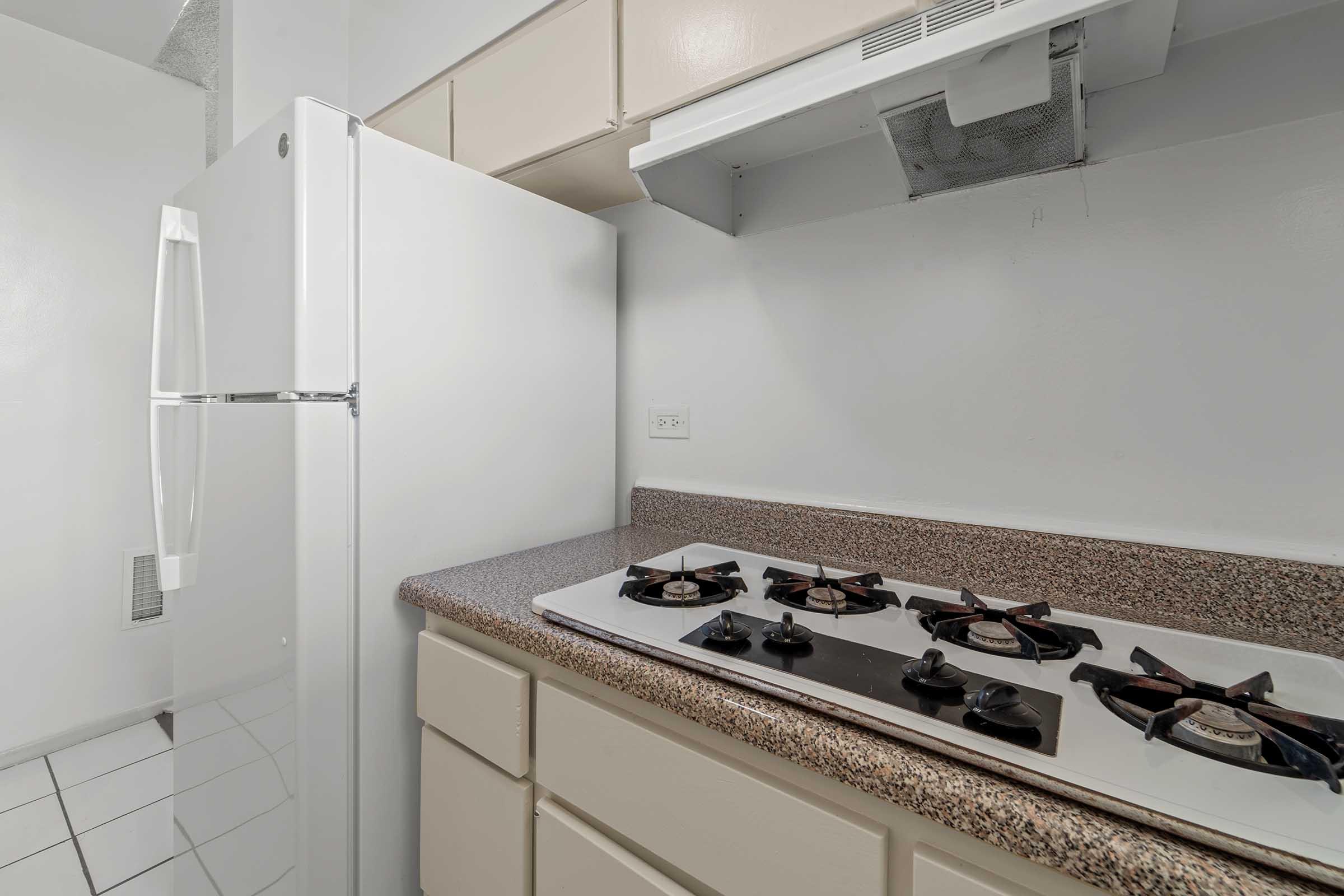 a kitchen with a stove and a sink