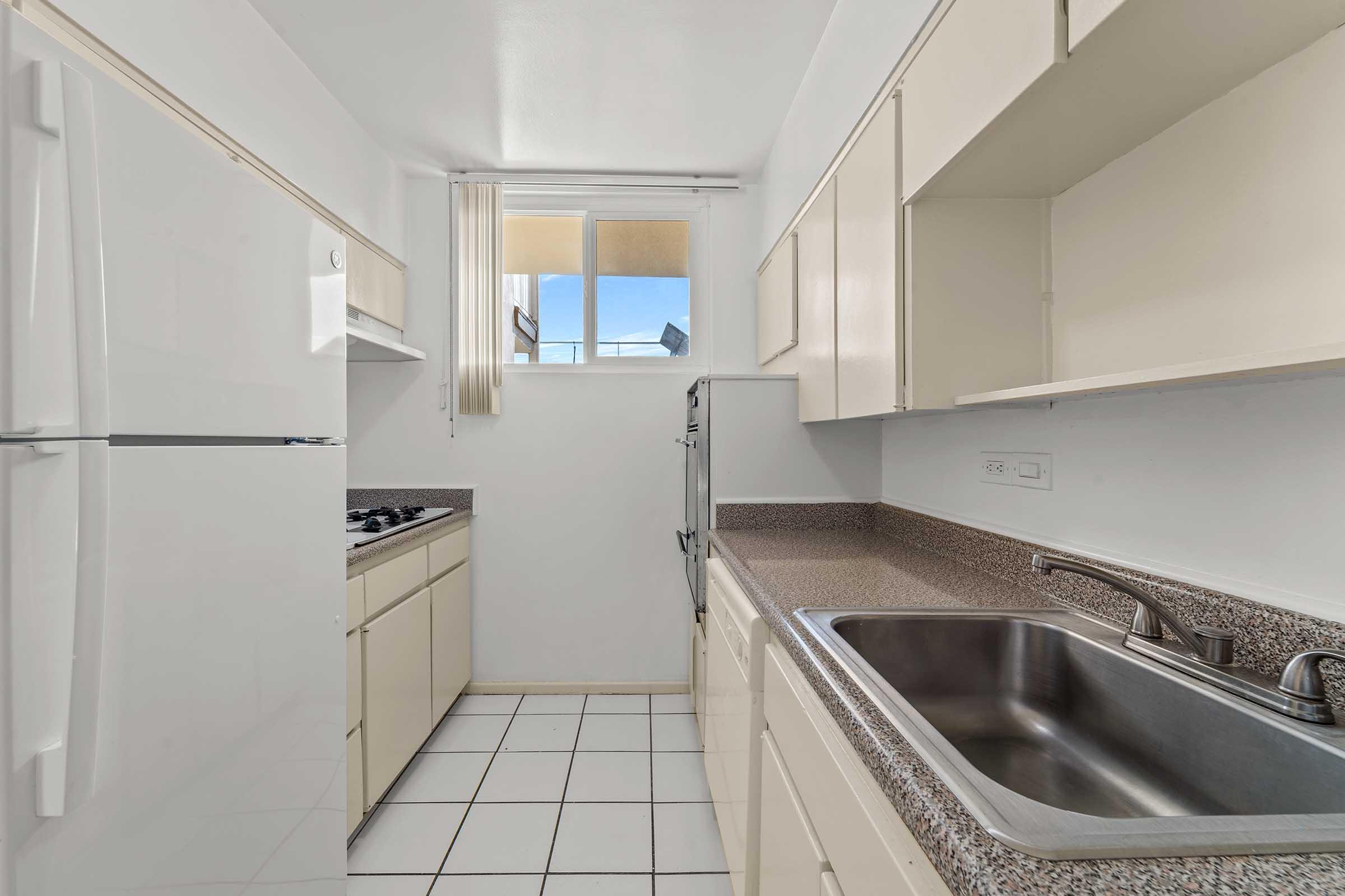 a kitchen with a tile floor