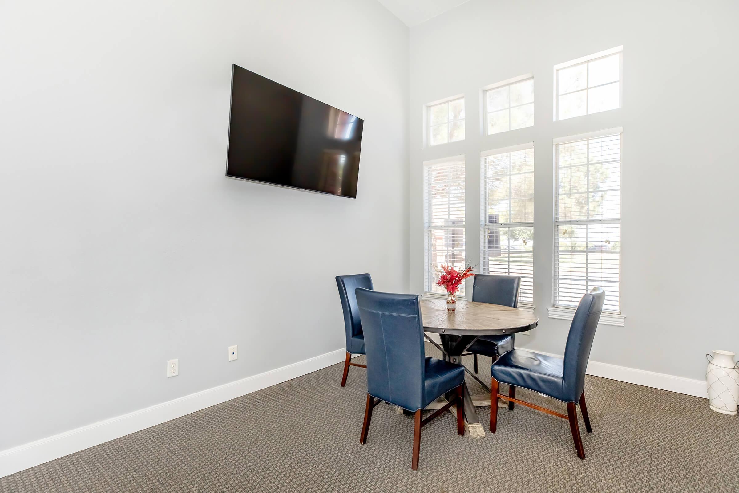 a room filled with furniture and a large window