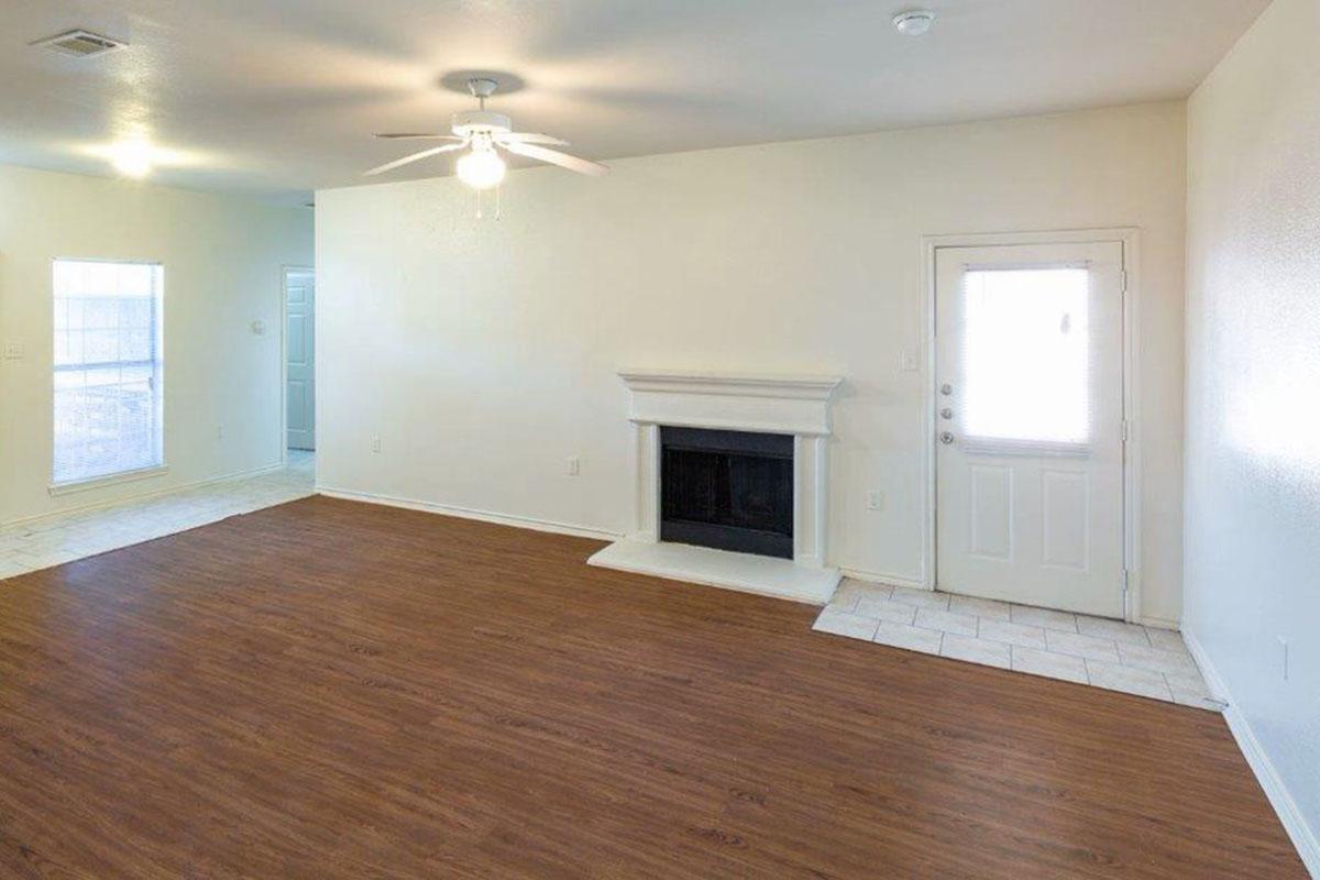 a view of a living room with a wood floor