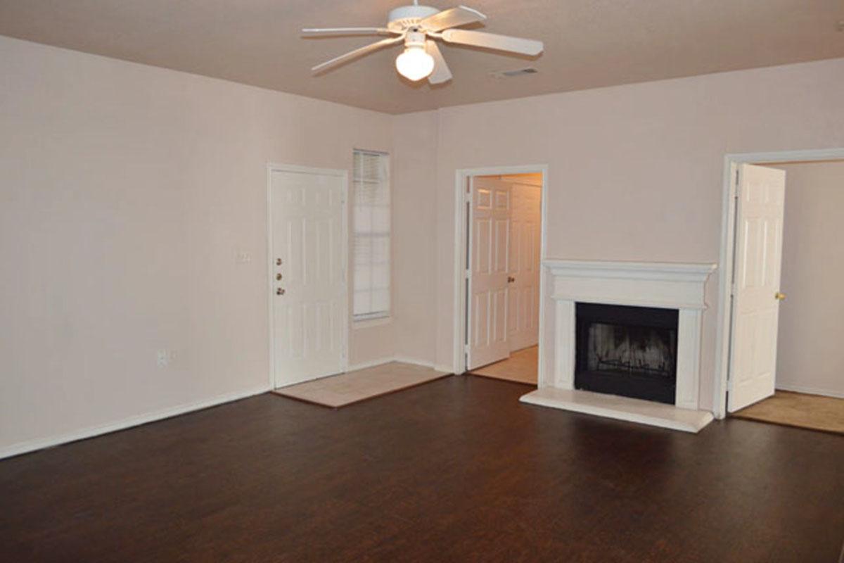 a flat screen tv sitting on top of a hard wood floor