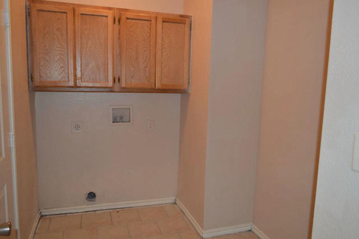 a kitchen with a sink and a refrigerator