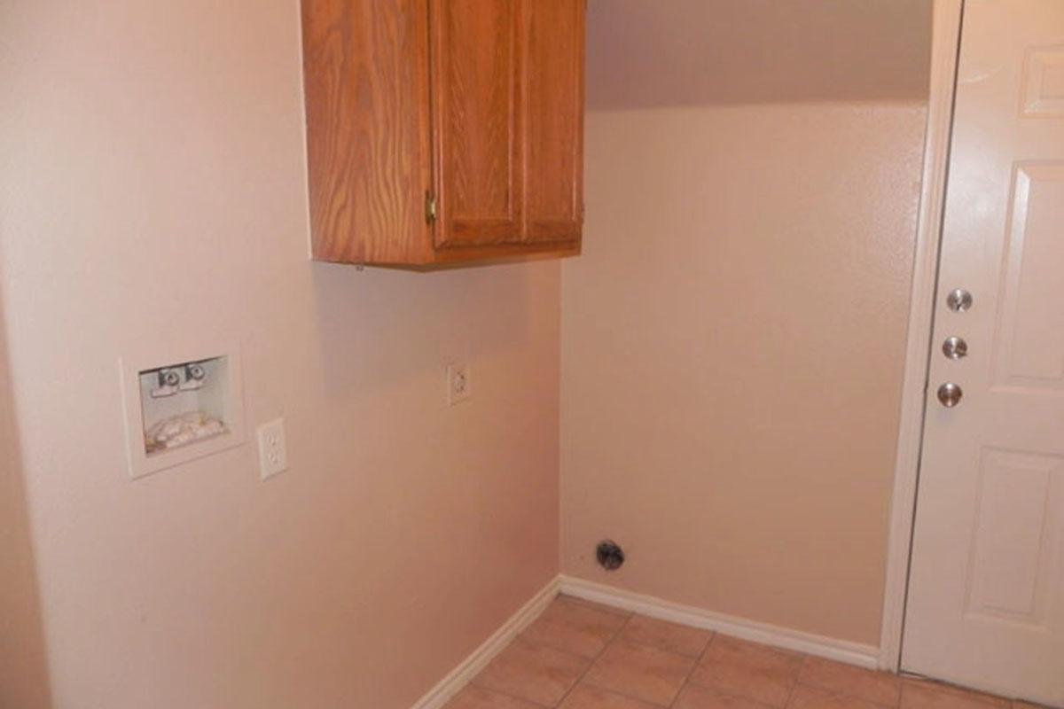 a kitchen with a sink and a refrigerator