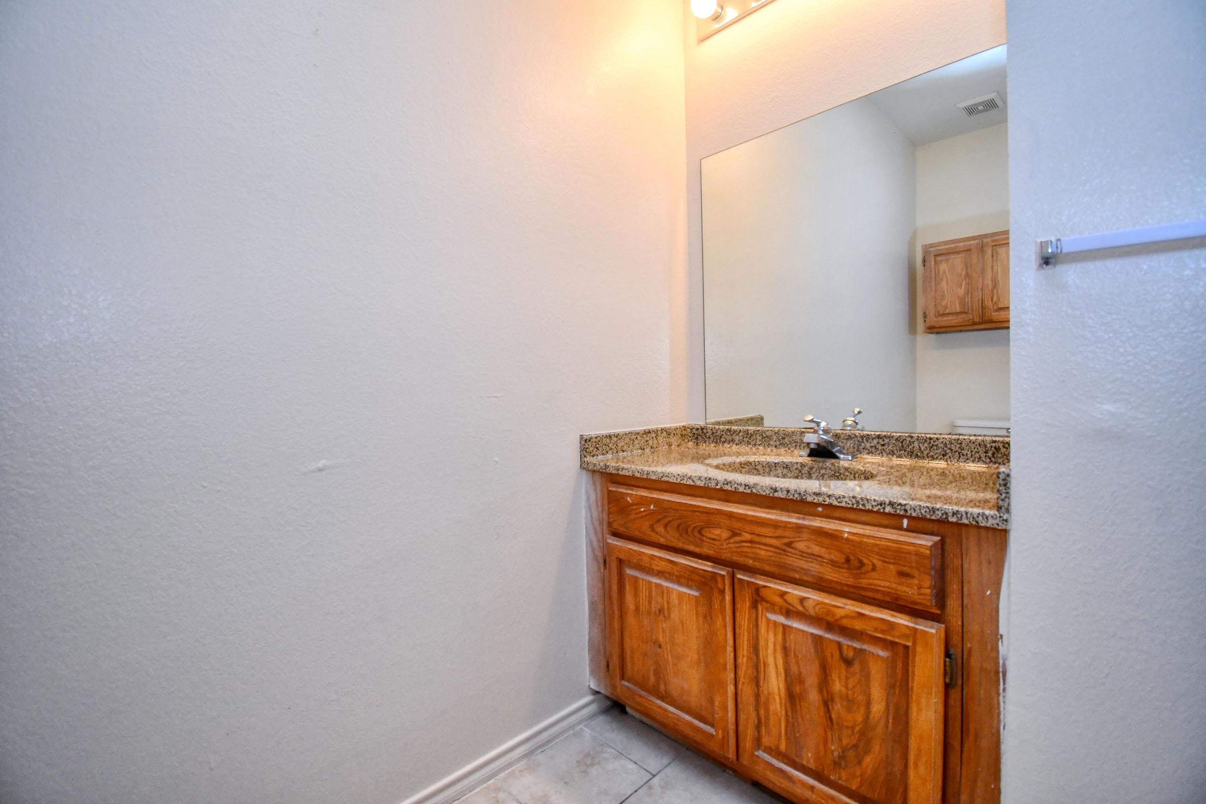 a kitchen with a sink and a refrigerator