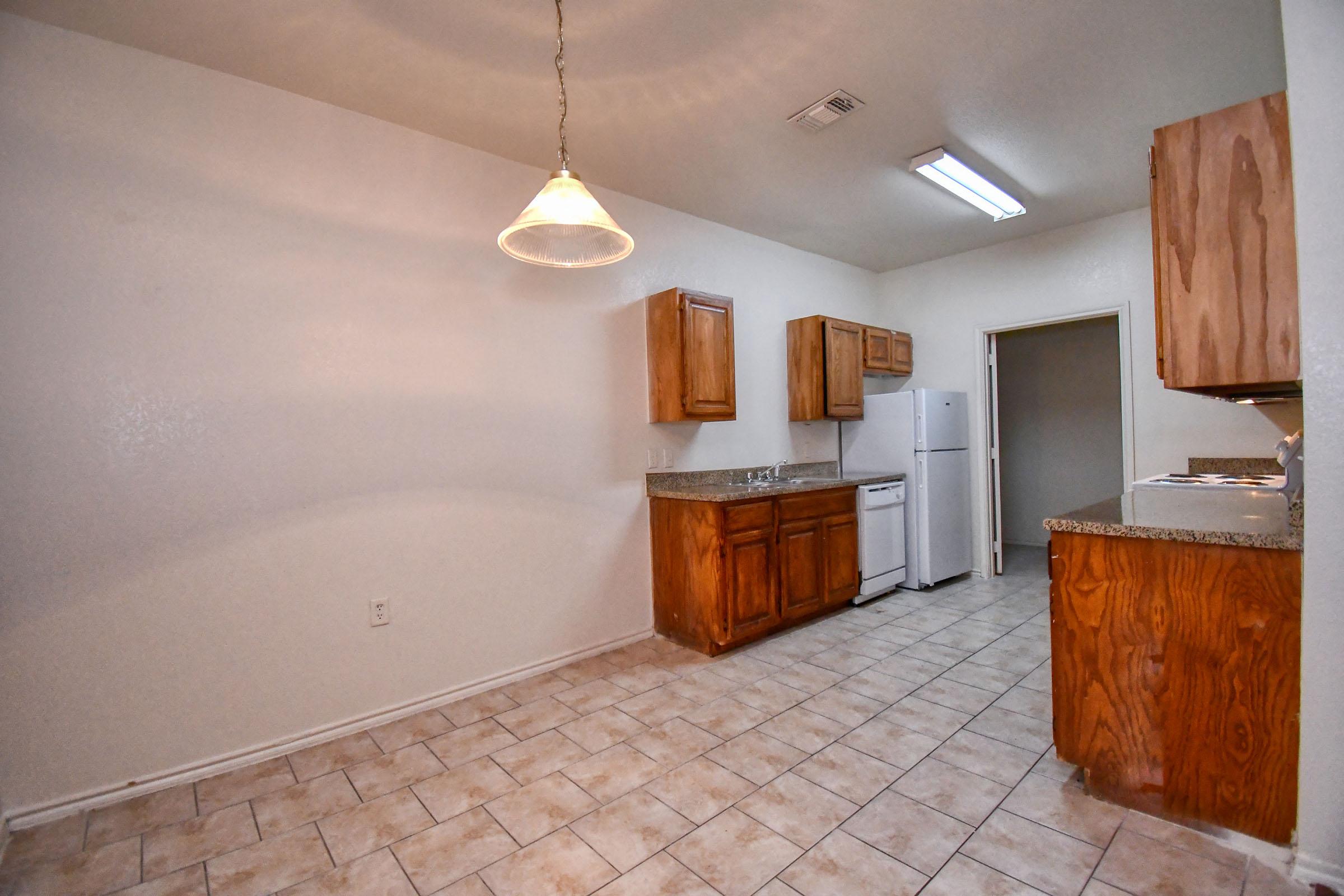 a kitchen with a wood floor