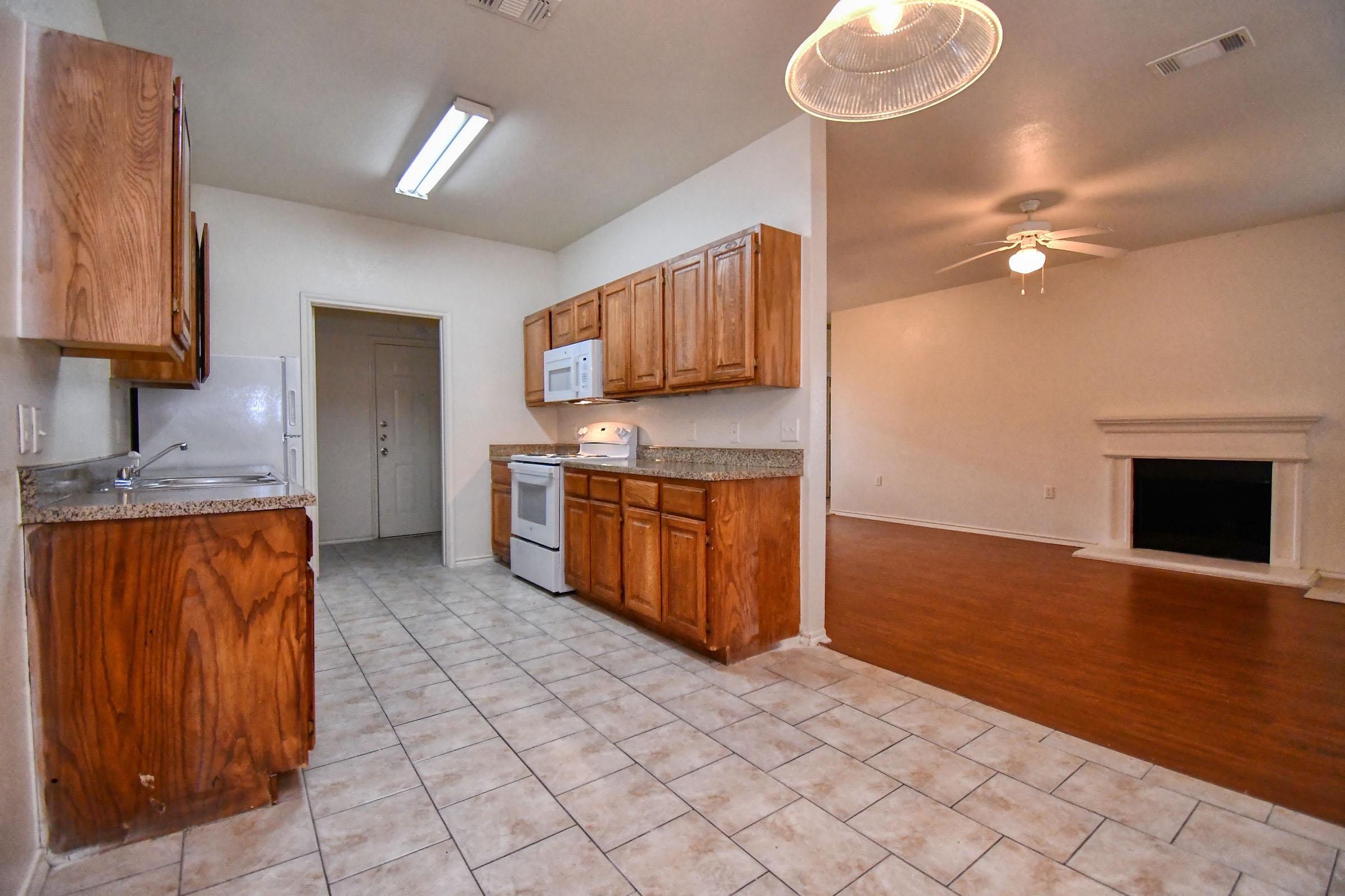 a kitchen with a wood floor