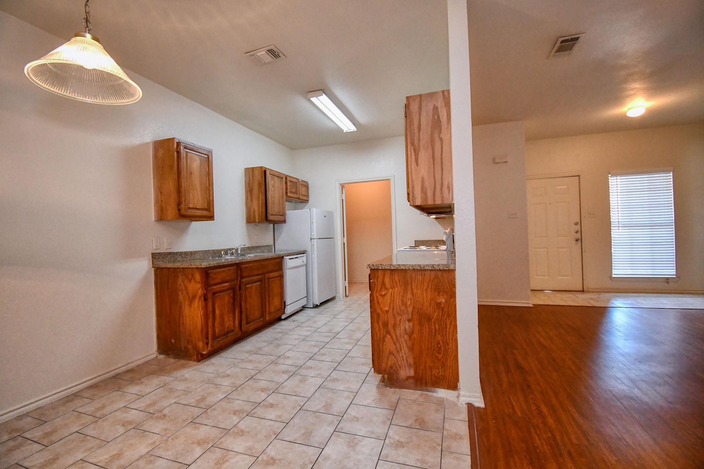 a kitchen with a wood floor