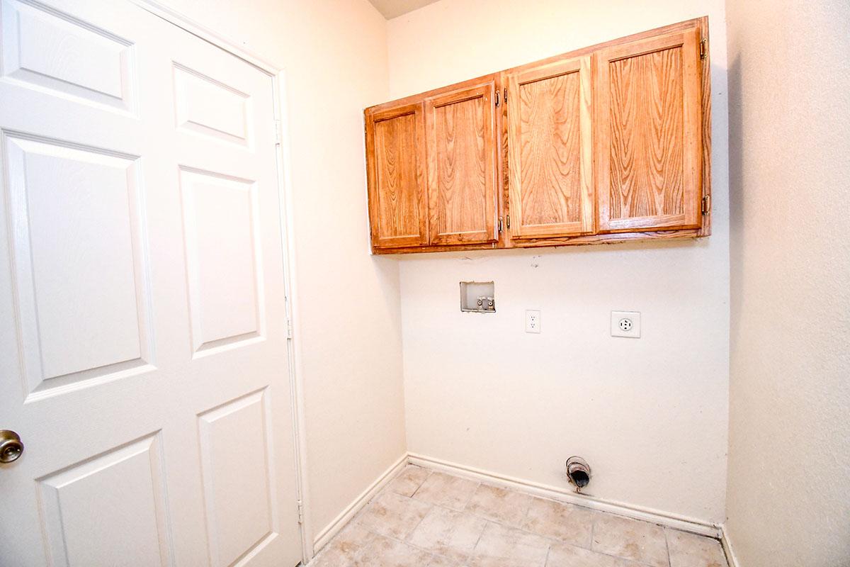 a kitchen with a sink and a refrigerator