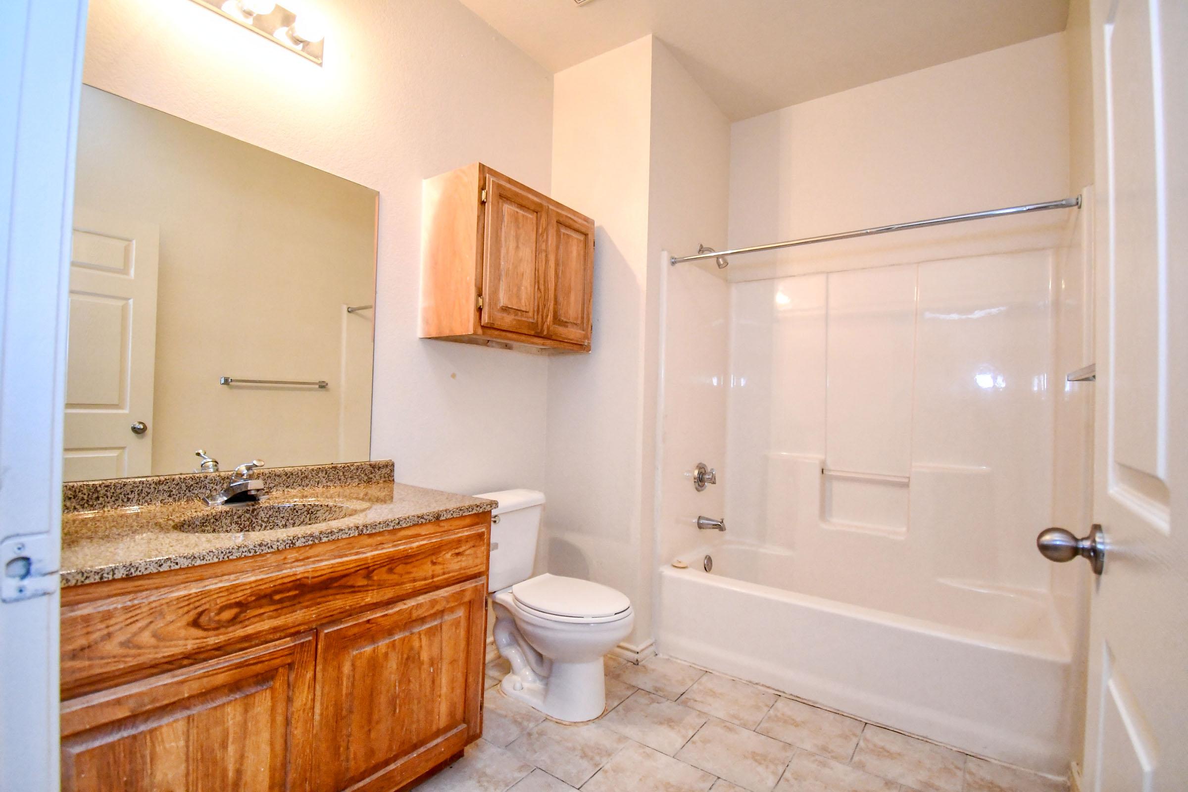 a kitchen with a sink and a mirror