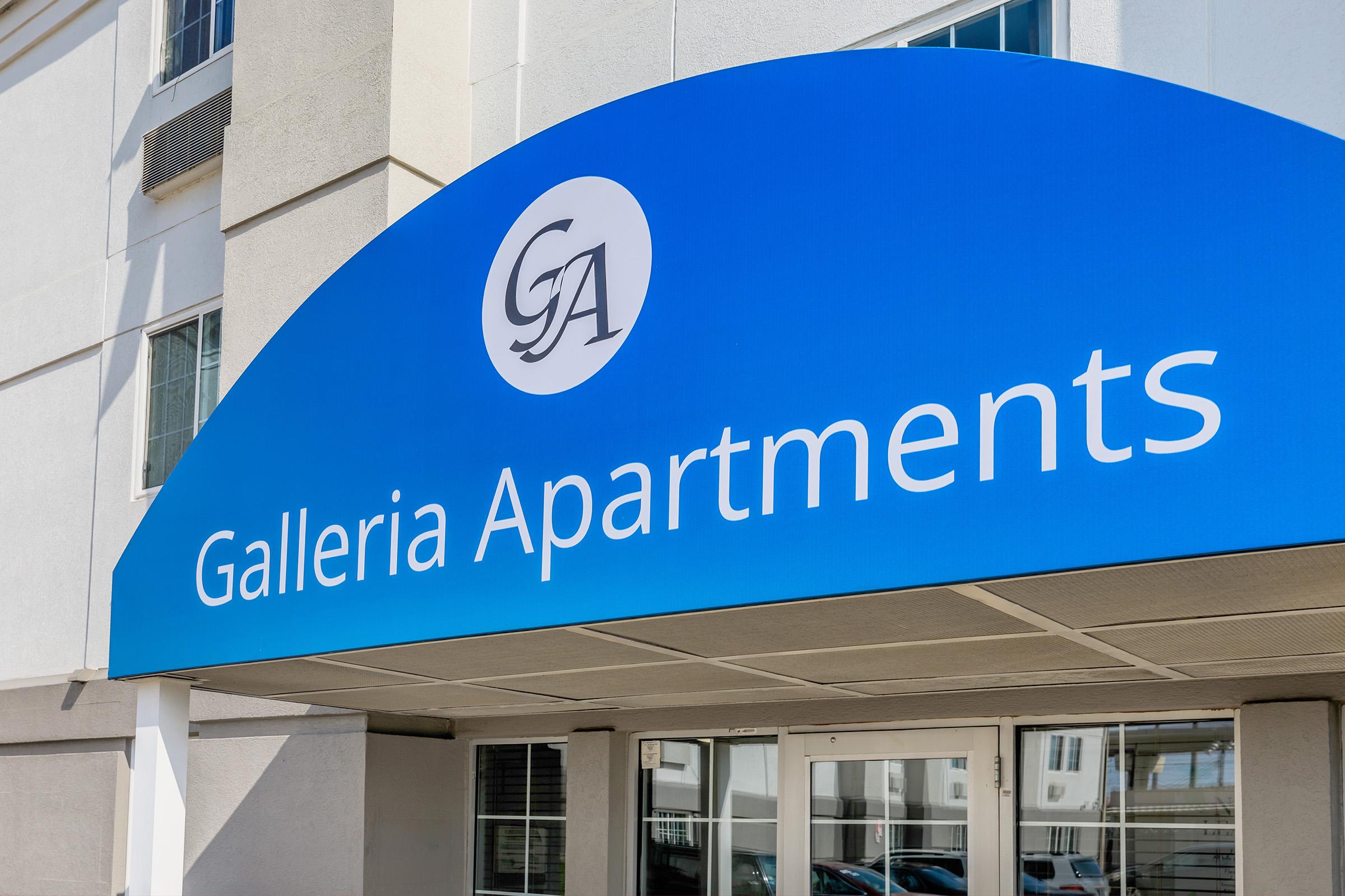 a blue sign in front of a building