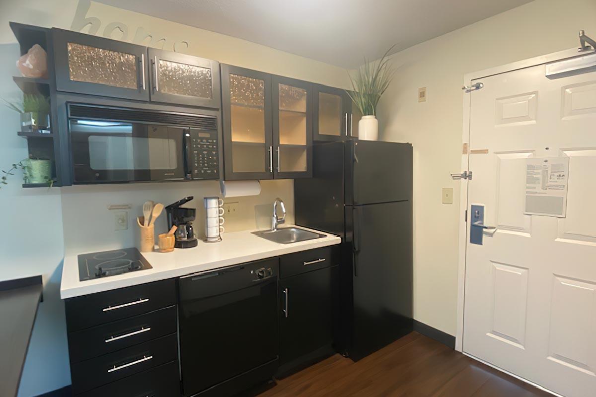 a kitchen with a sink and a microwave