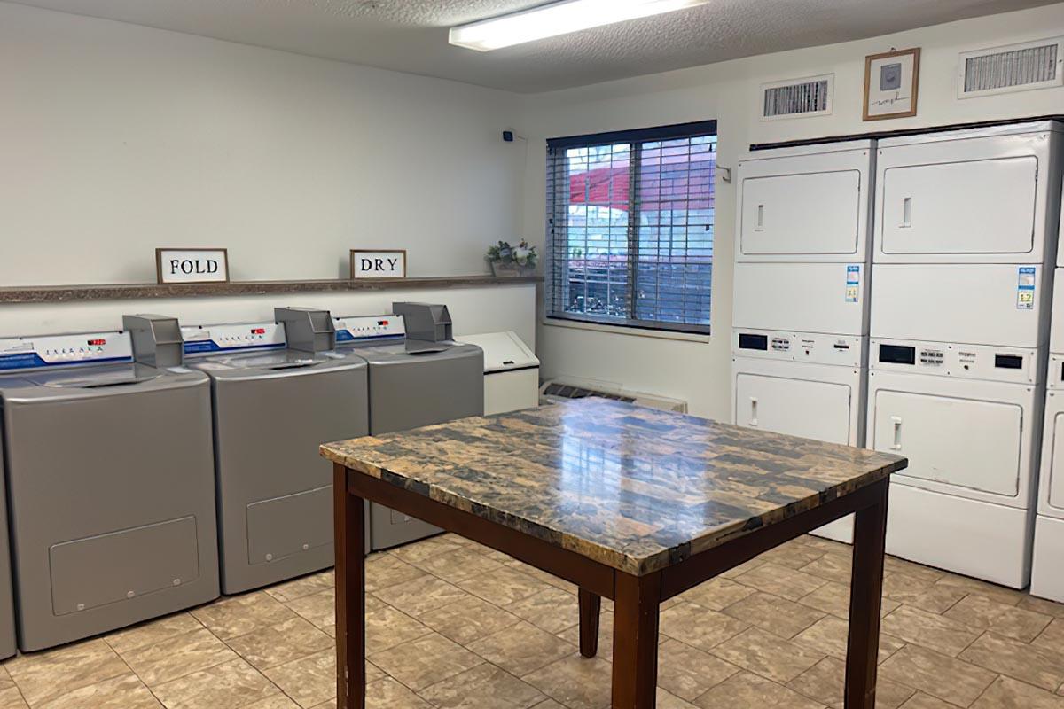 a kitchen with a table in a room