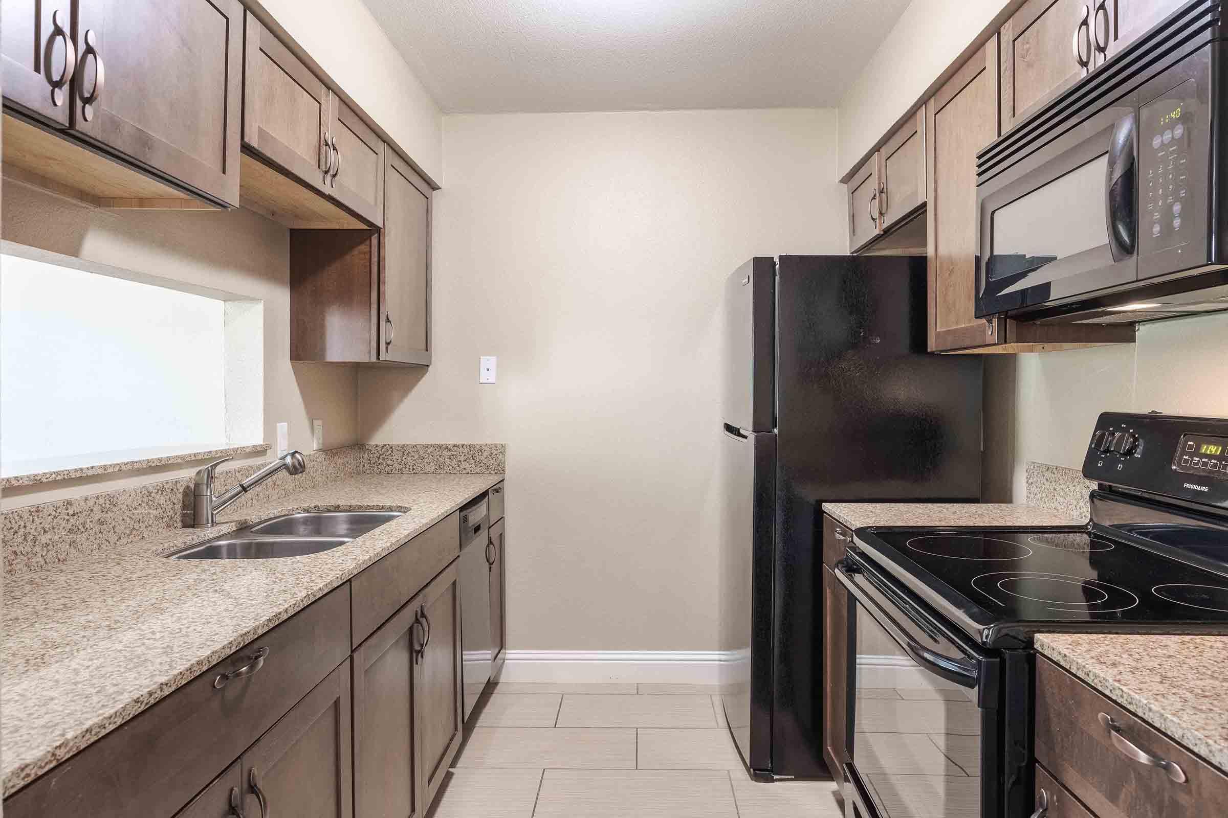 a kitchen with a stove top oven