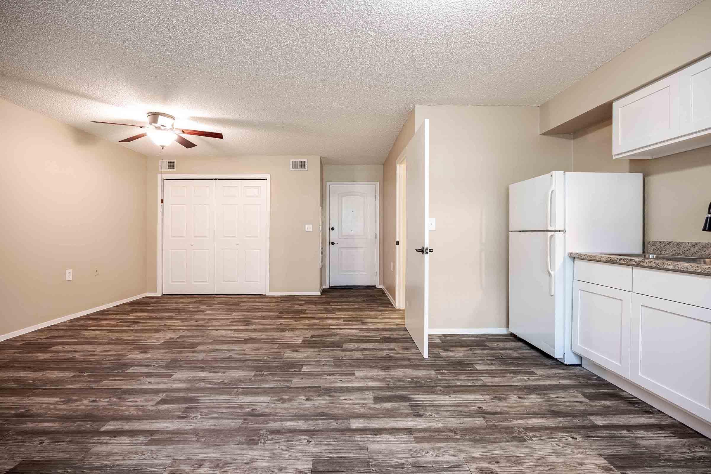 a large empty room with a wooden floor