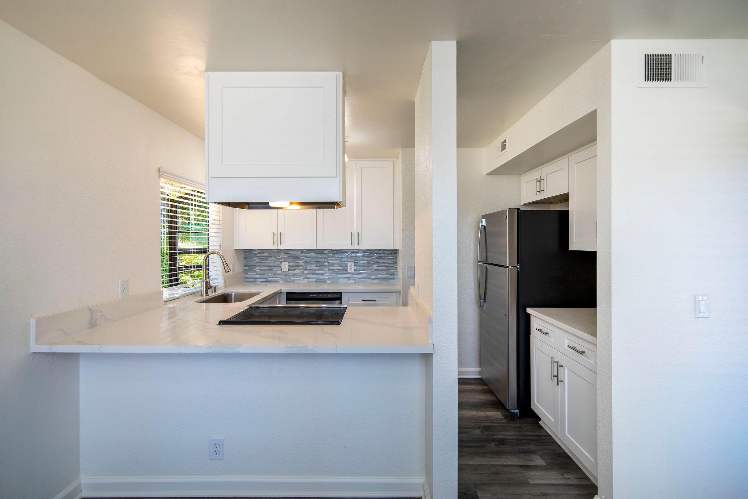 a stainless steel refrigerator in a kitchen