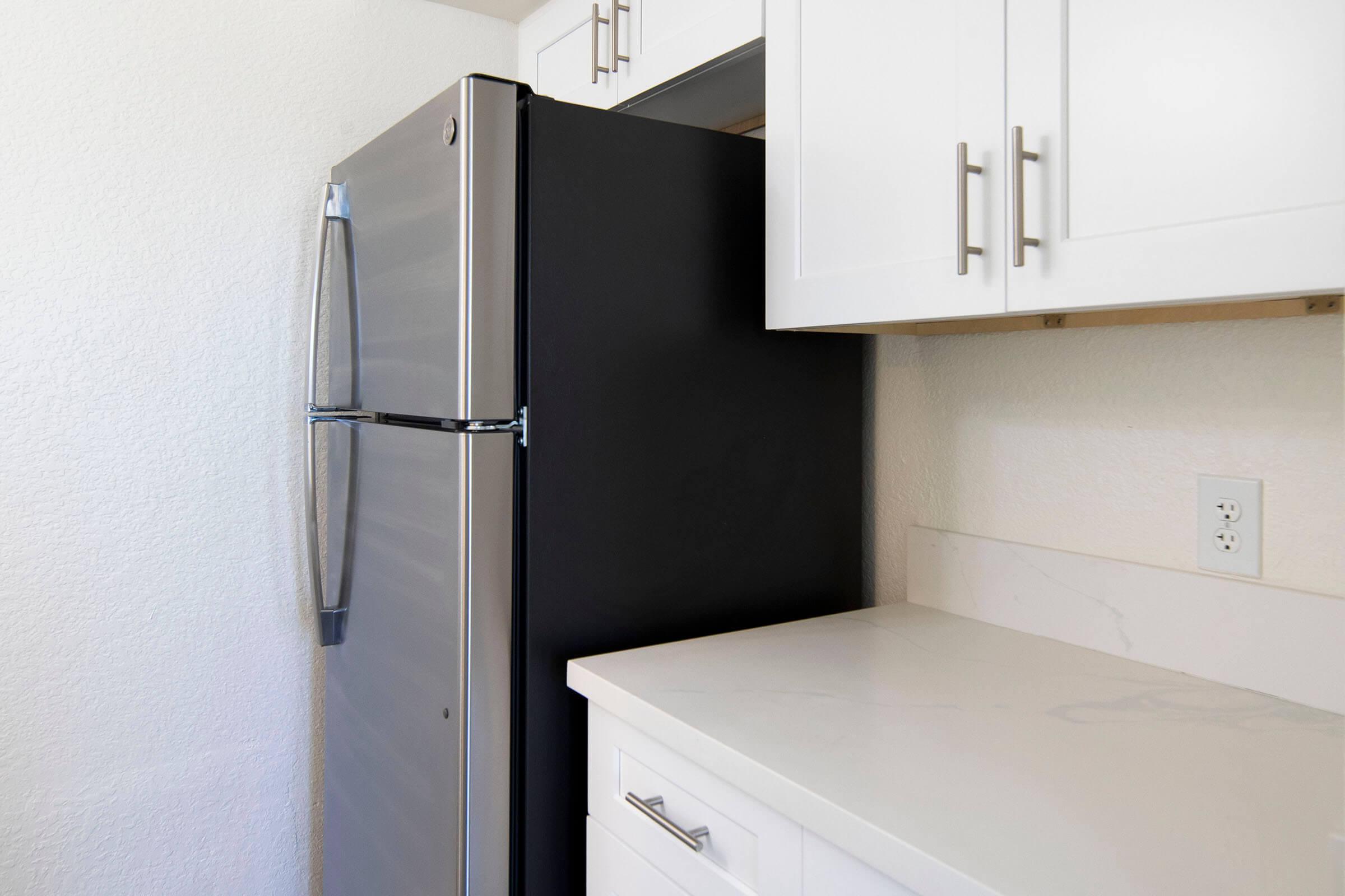 a stainless steel refrigerator in a kitchen