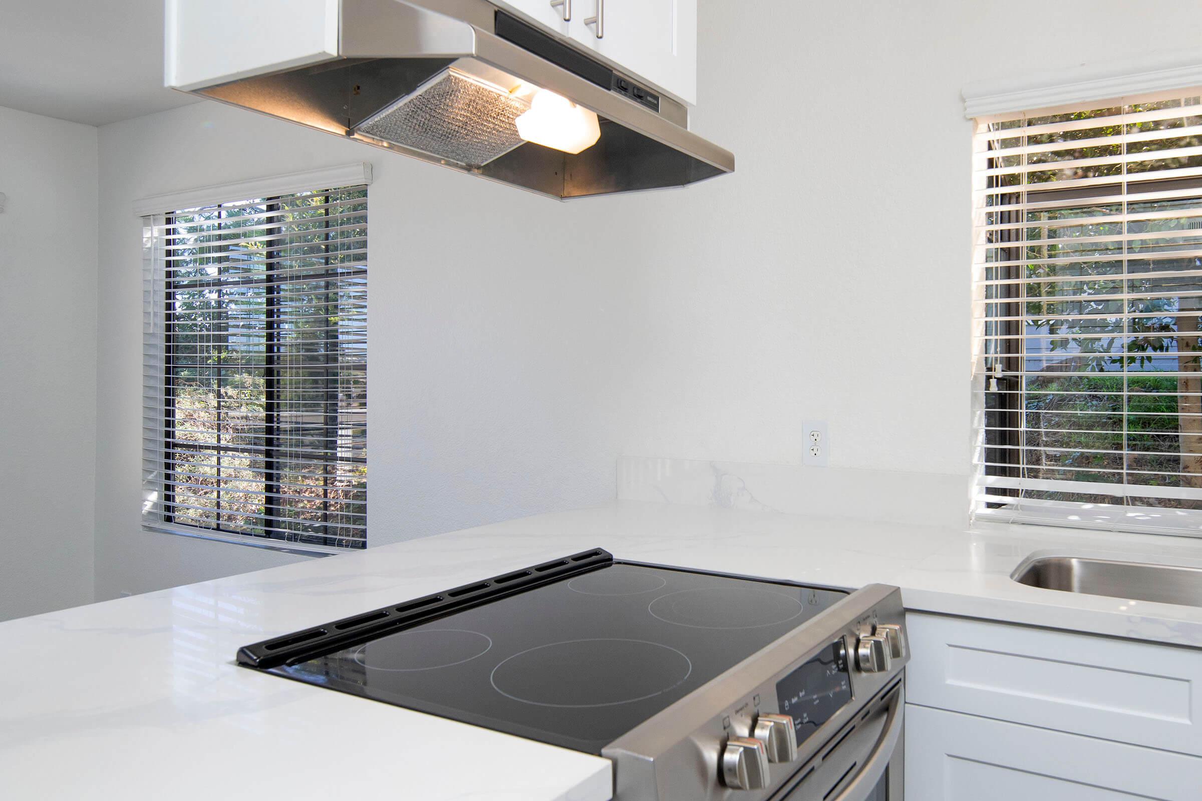 a kitchen with a sink and a window