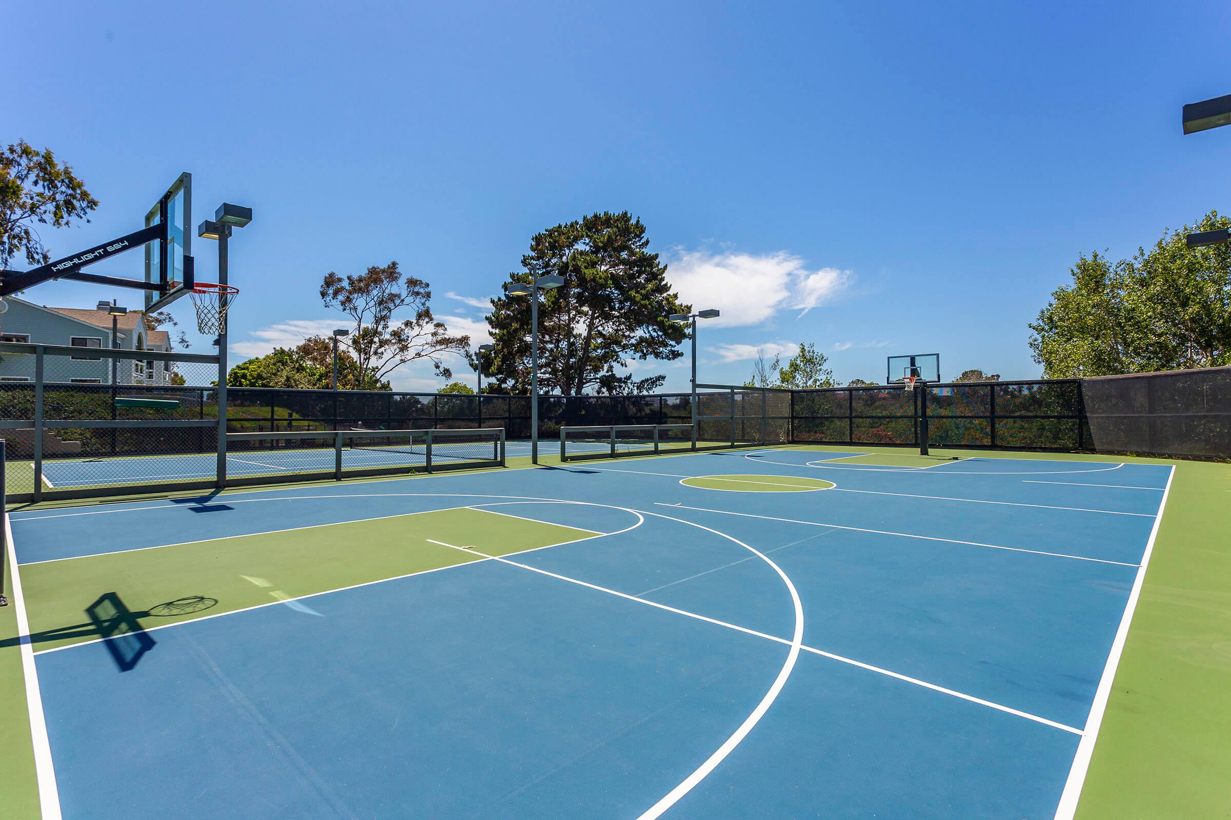 a basketball on a court with a racket