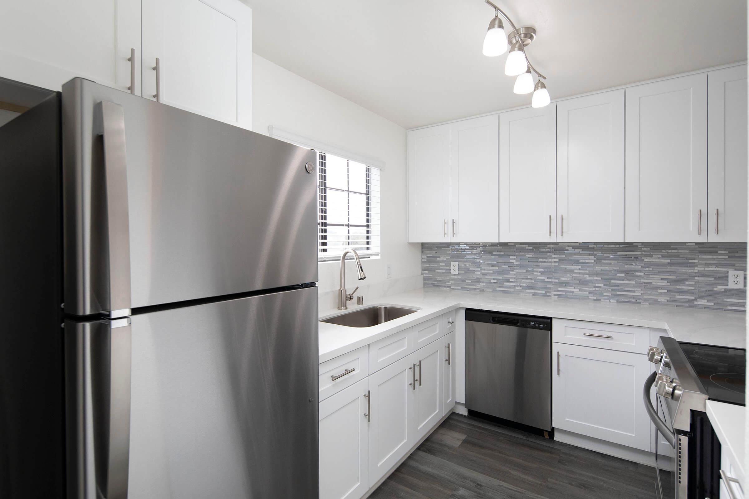 a stainless steel refrigerator in a kitchen