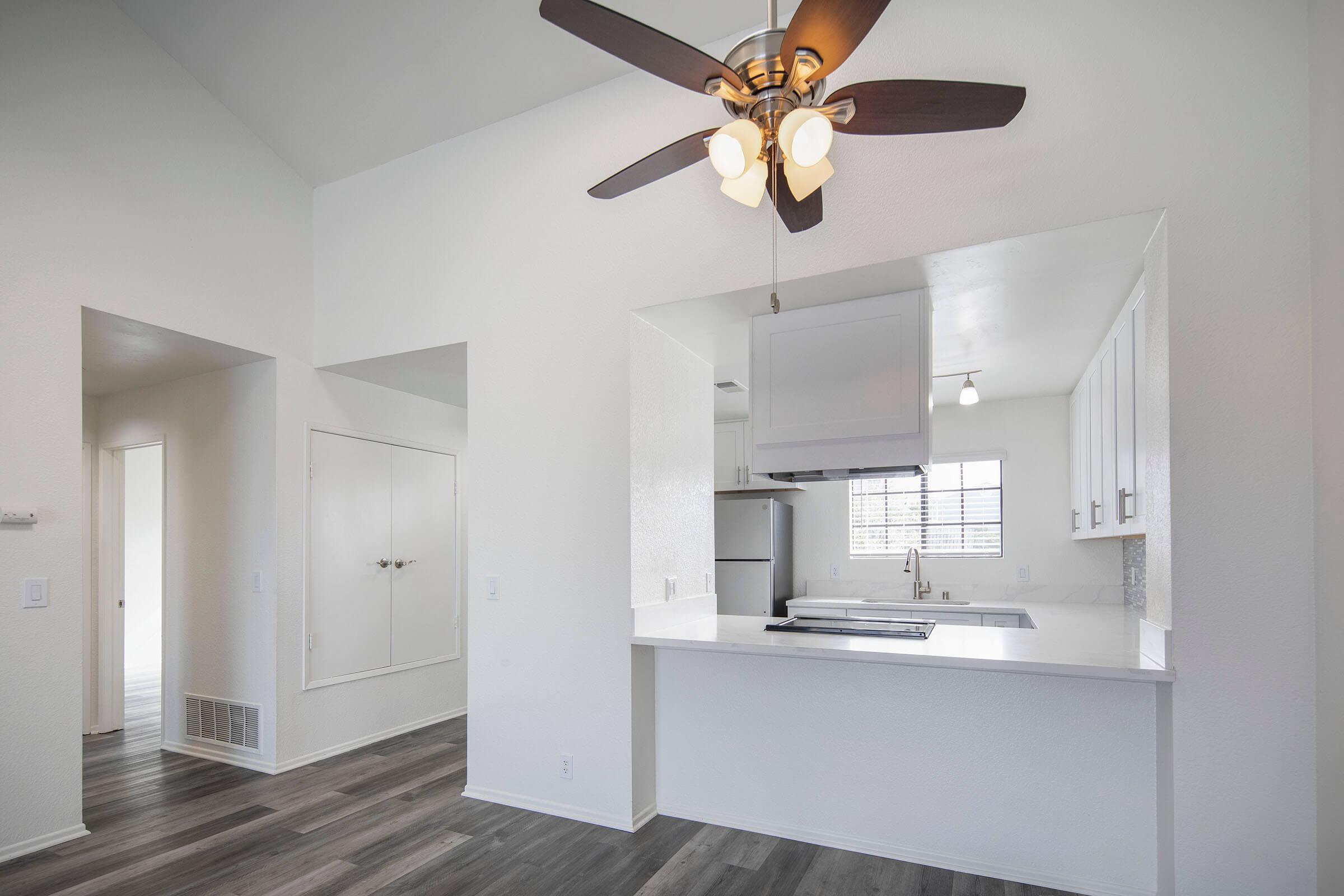 a kitchen with a sink and a refrigerator