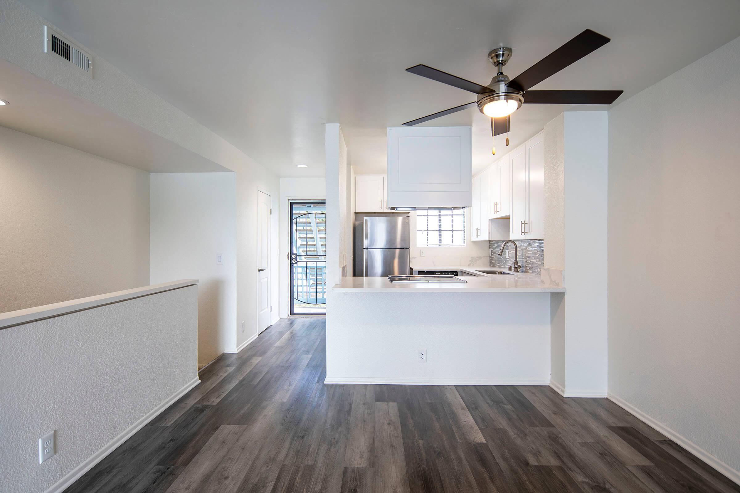 a kitchen with a wood floor