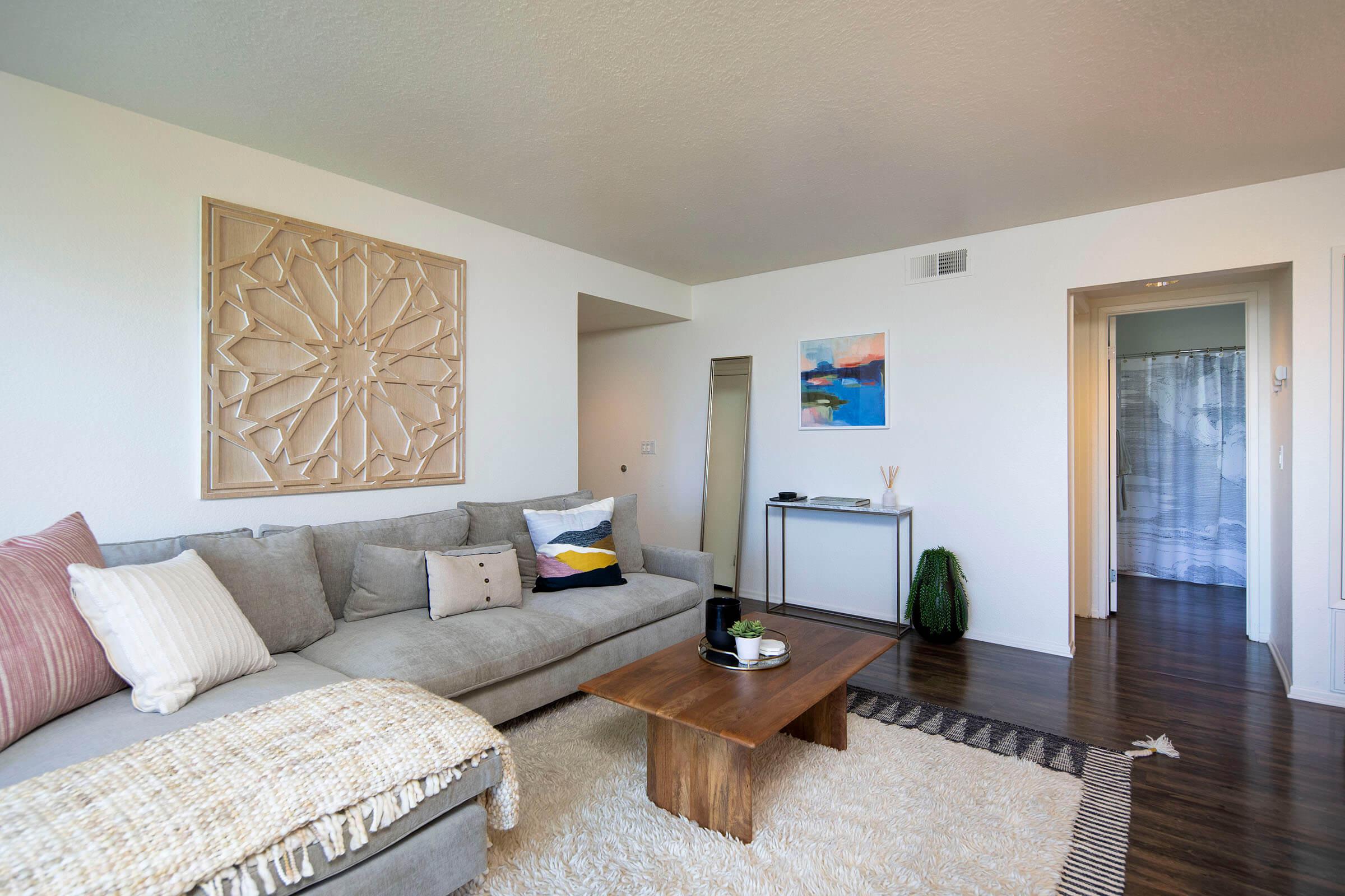 a bedroom with a view of a living room