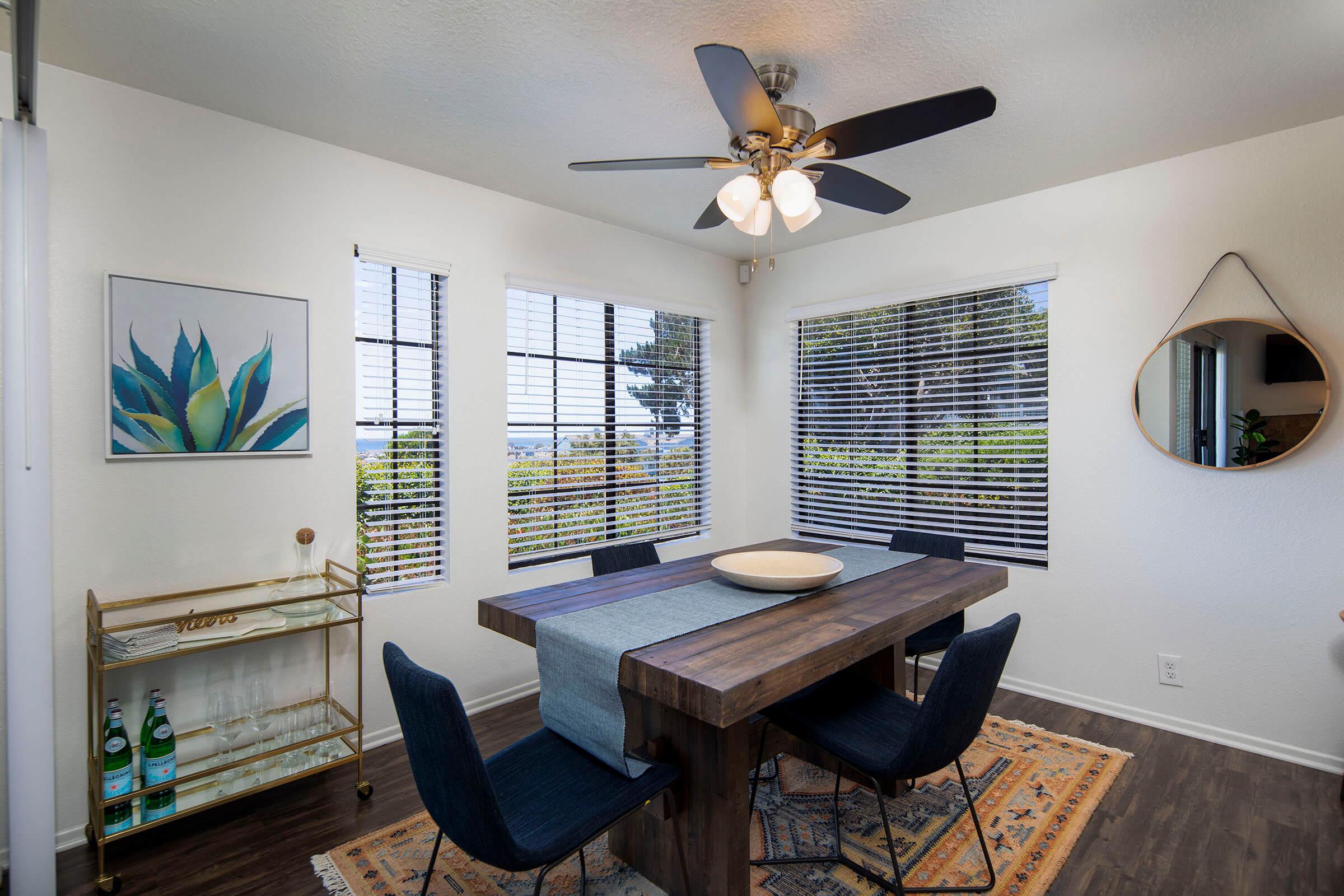 a room filled with furniture and a large window