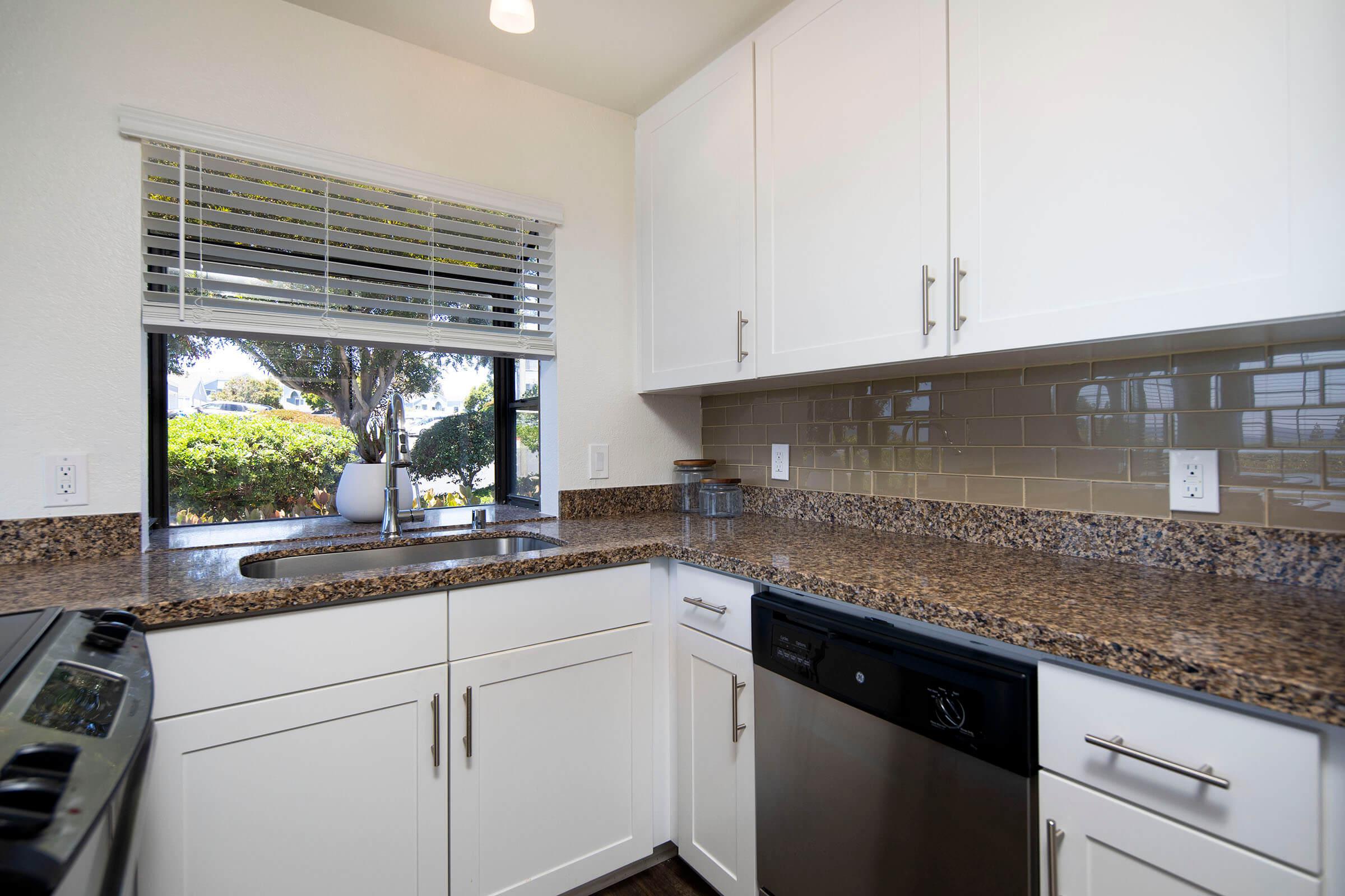 a large kitchen with stainless steel appliances