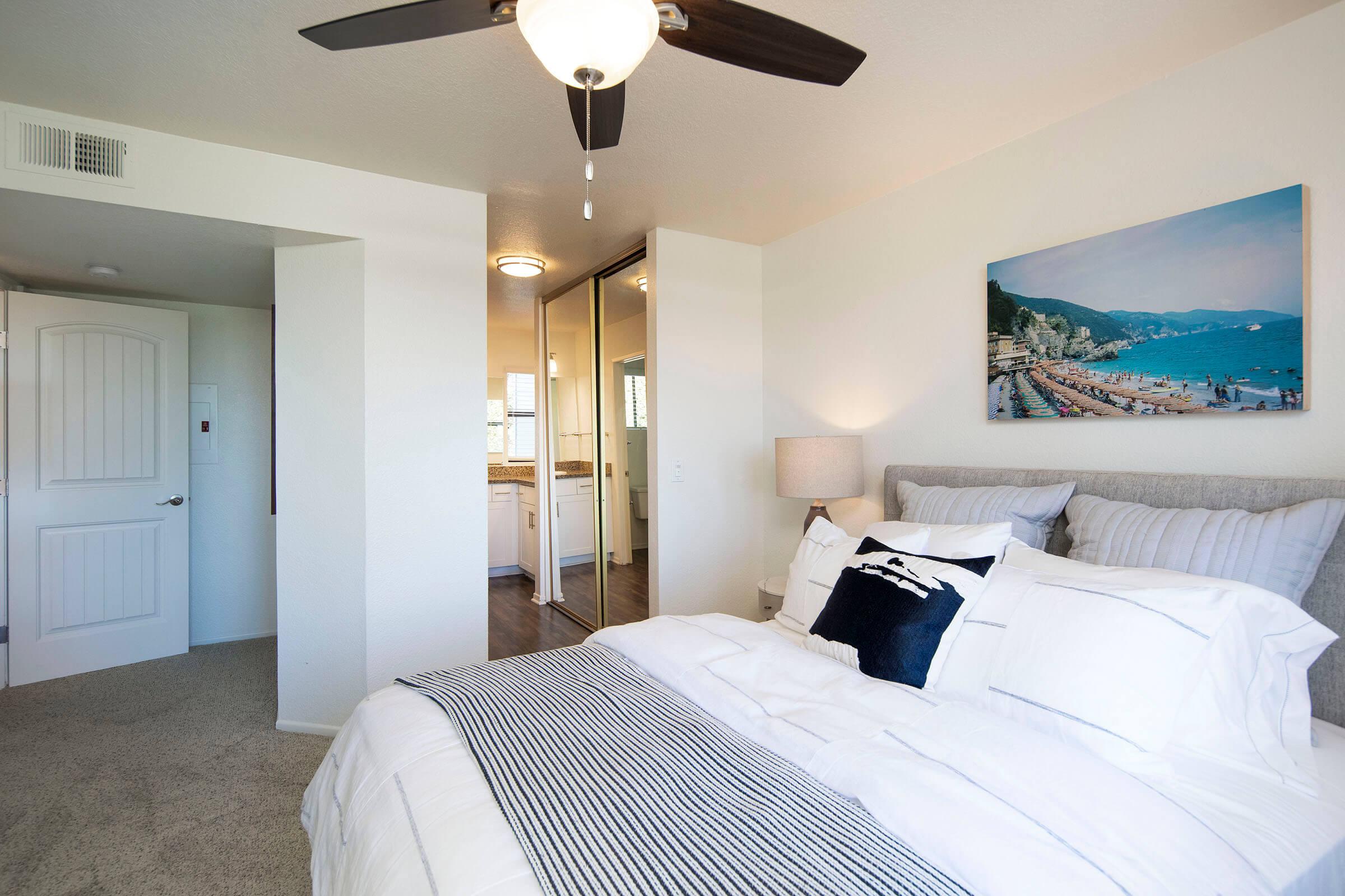 a bedroom with a large bed in a hotel room