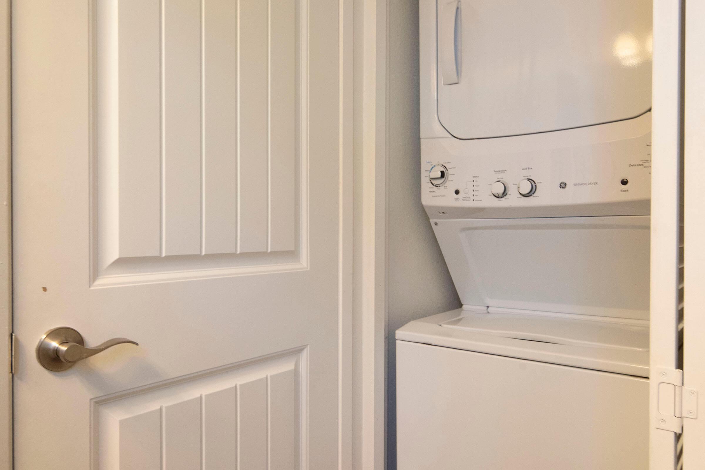 a microwave oven sitting on top of a refrigerator