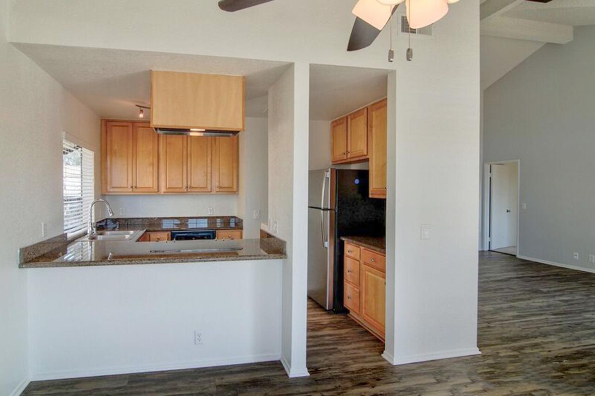 a kitchen with a sink and a refrigerator