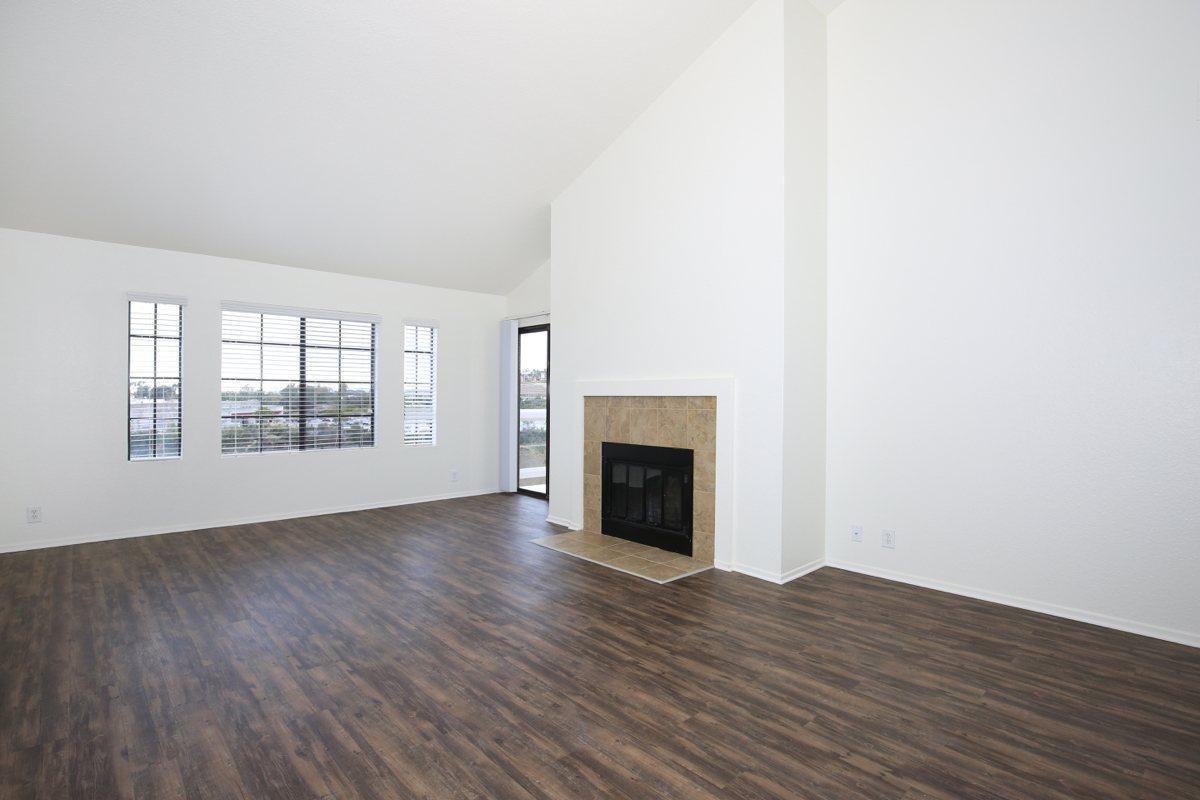 a large empty room with a wood floor