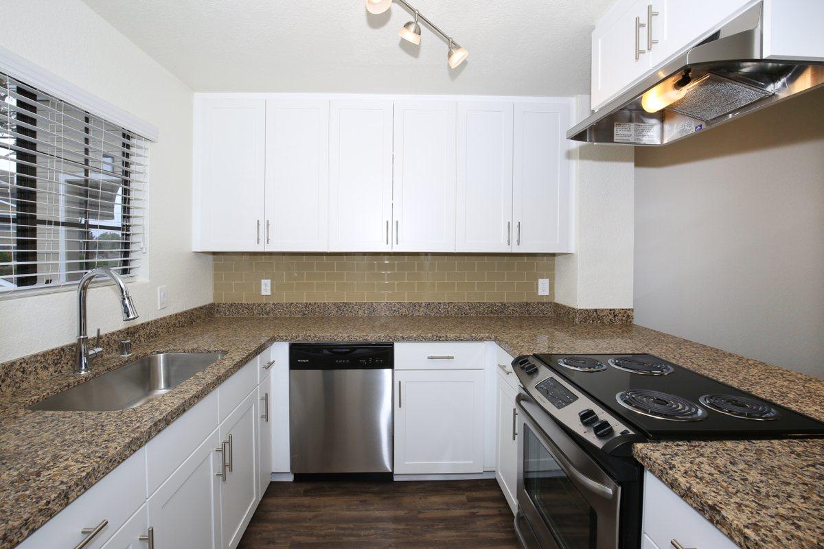 a kitchen with a stove top oven