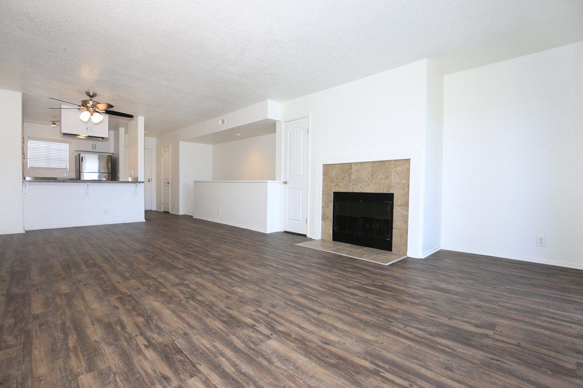 a large empty room with a wood floor