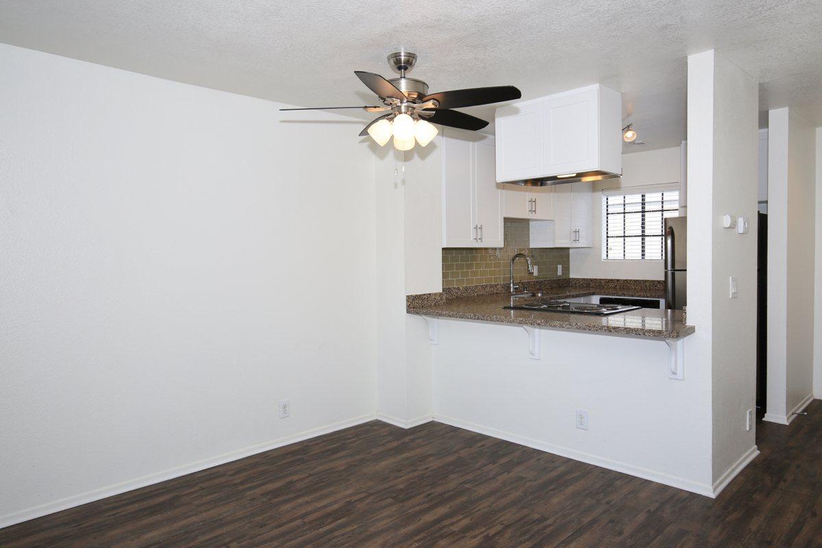 a kitchen with a sink and a mirror