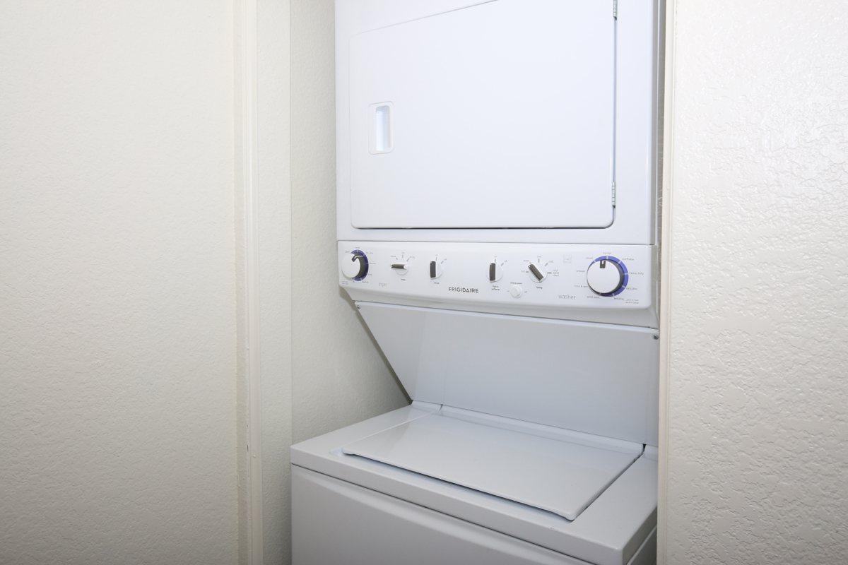 a white refrigerator freezer sitting in a room