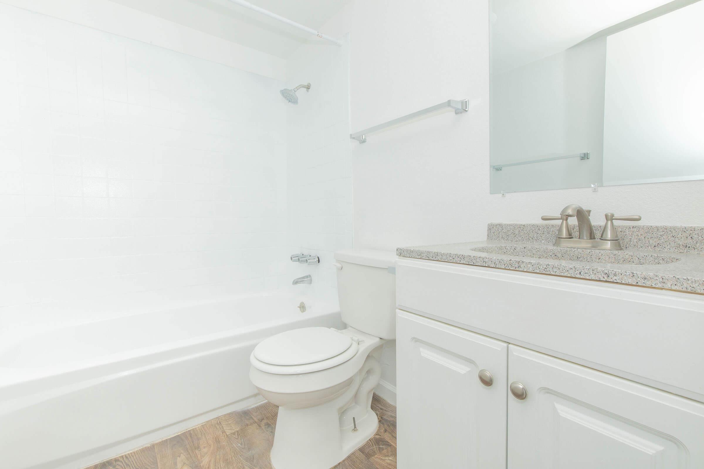 a room with a sink and a shower