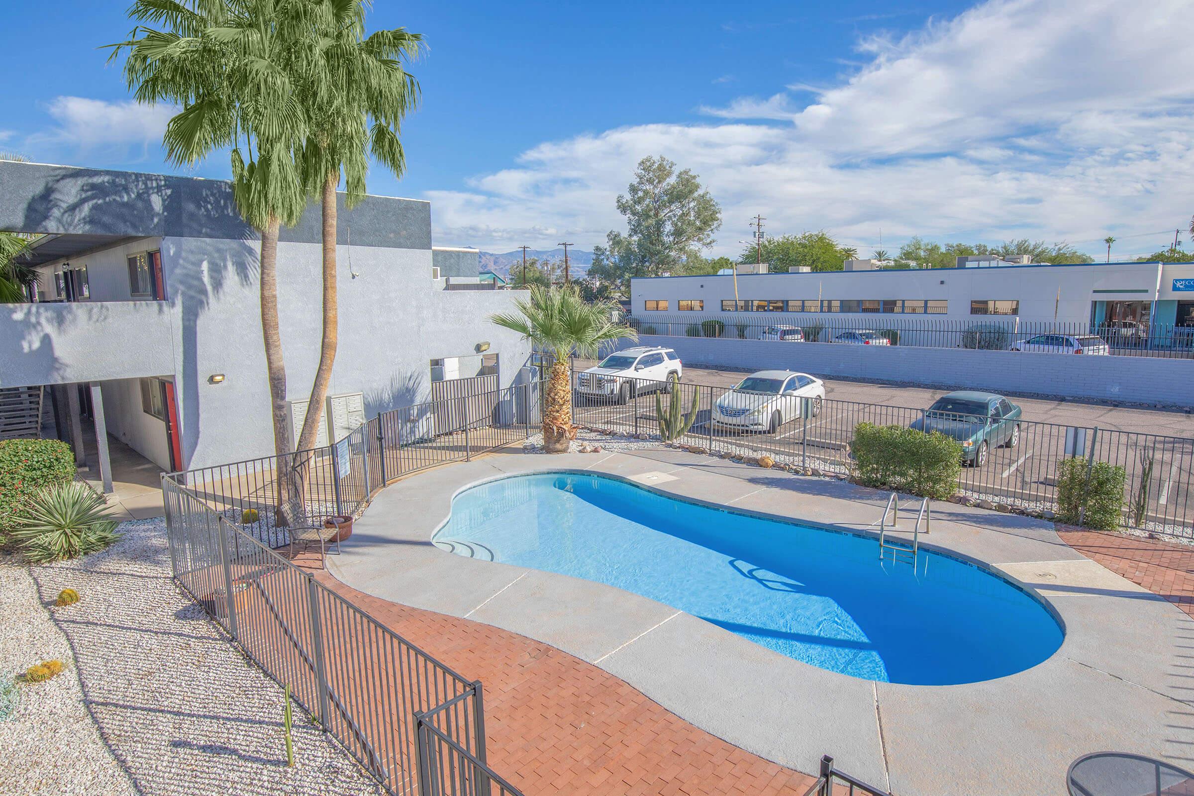 a pool next to a fence