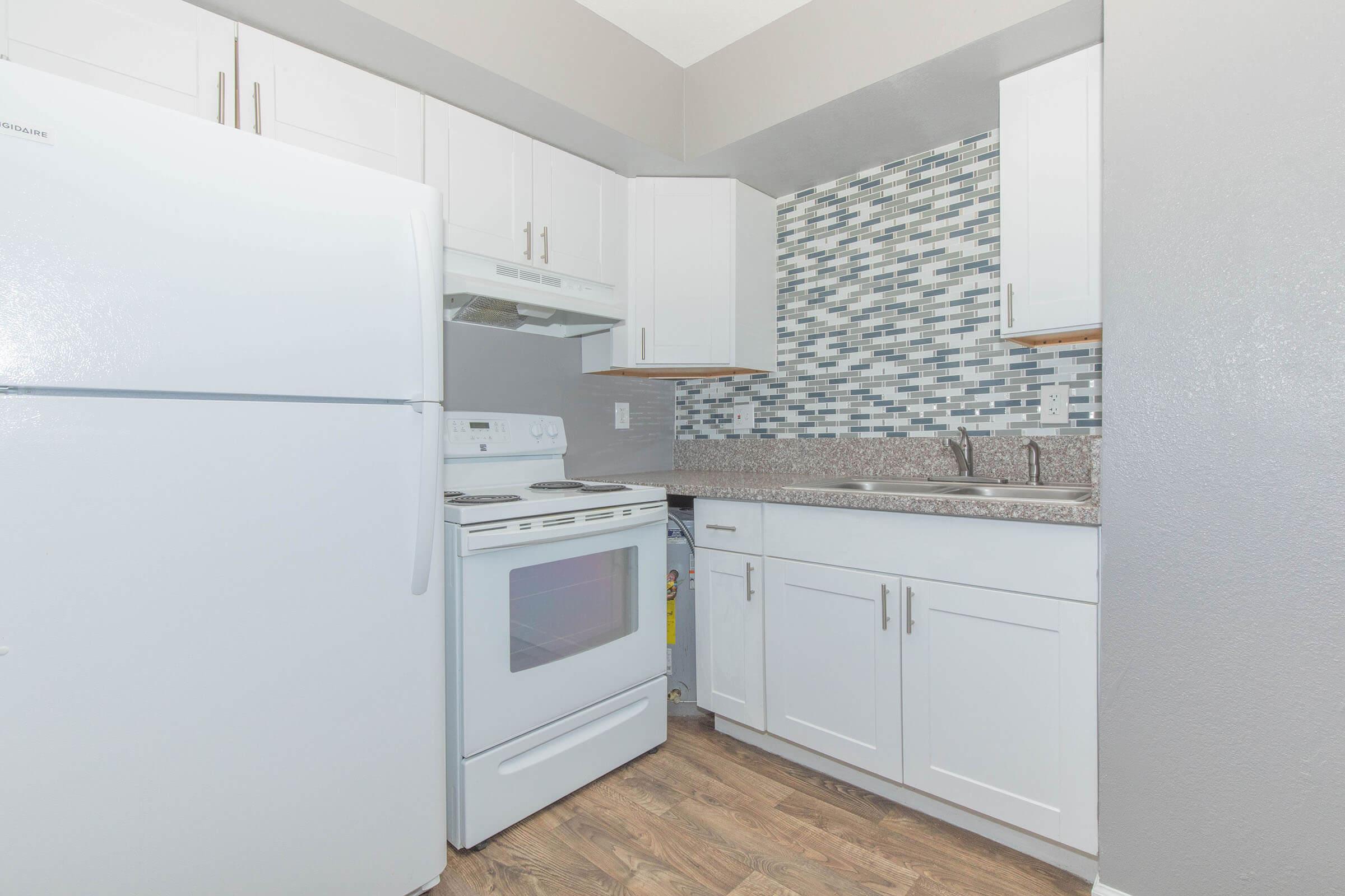 a kitchen with a stove top oven sitting inside of a refrigerator