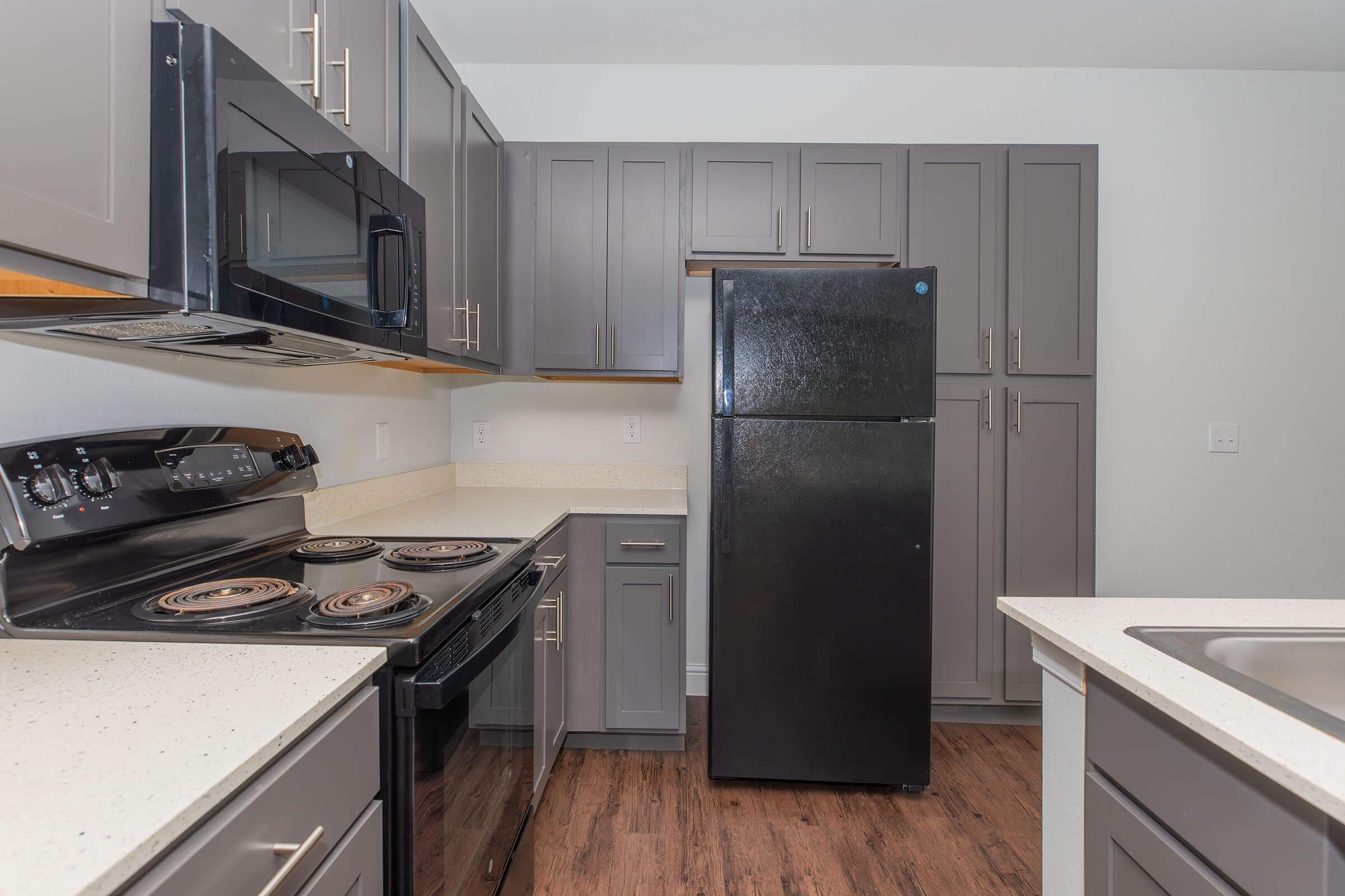 a kitchen with a stove top oven