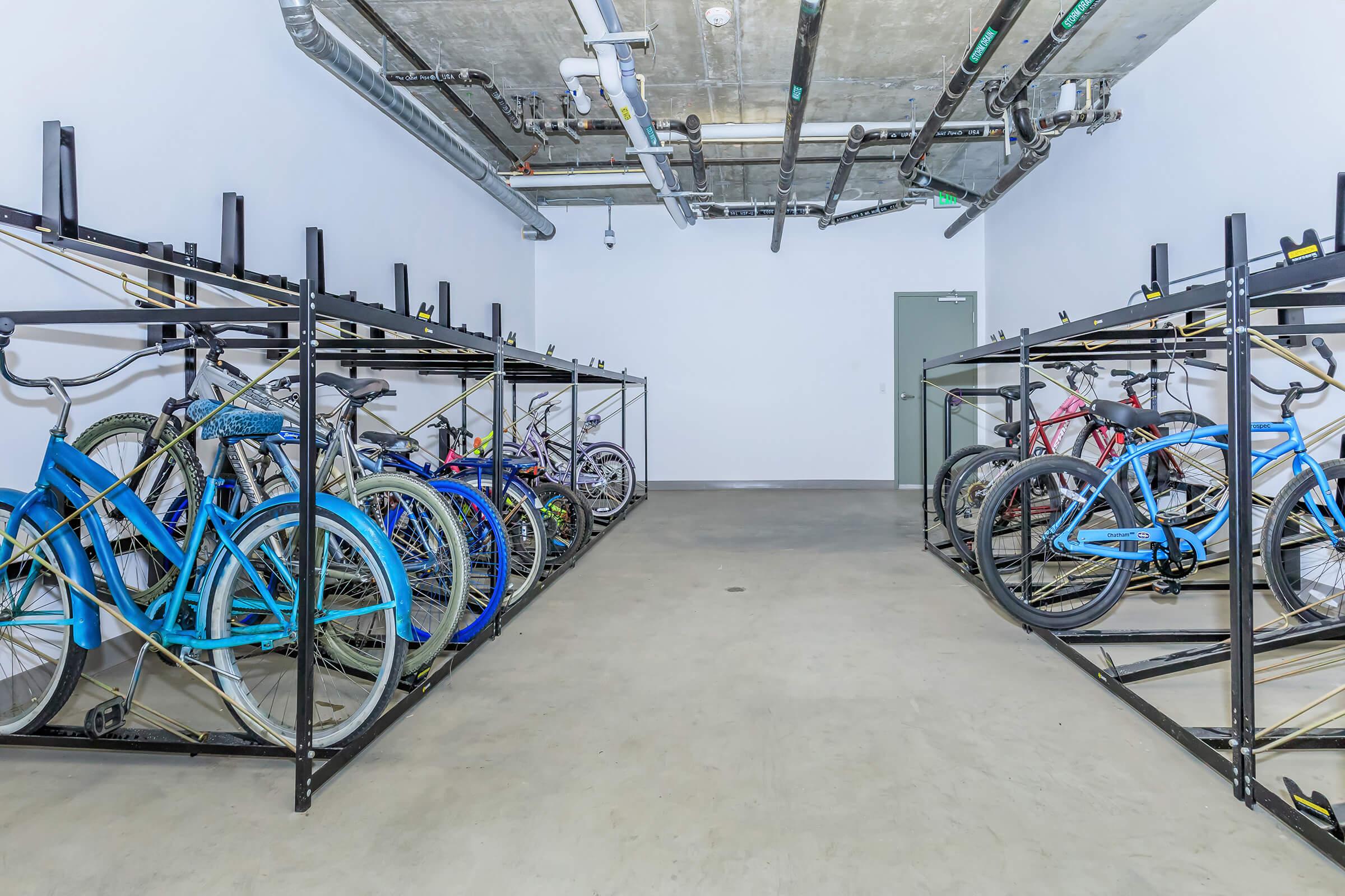 a bicycle is parked near a metal rail