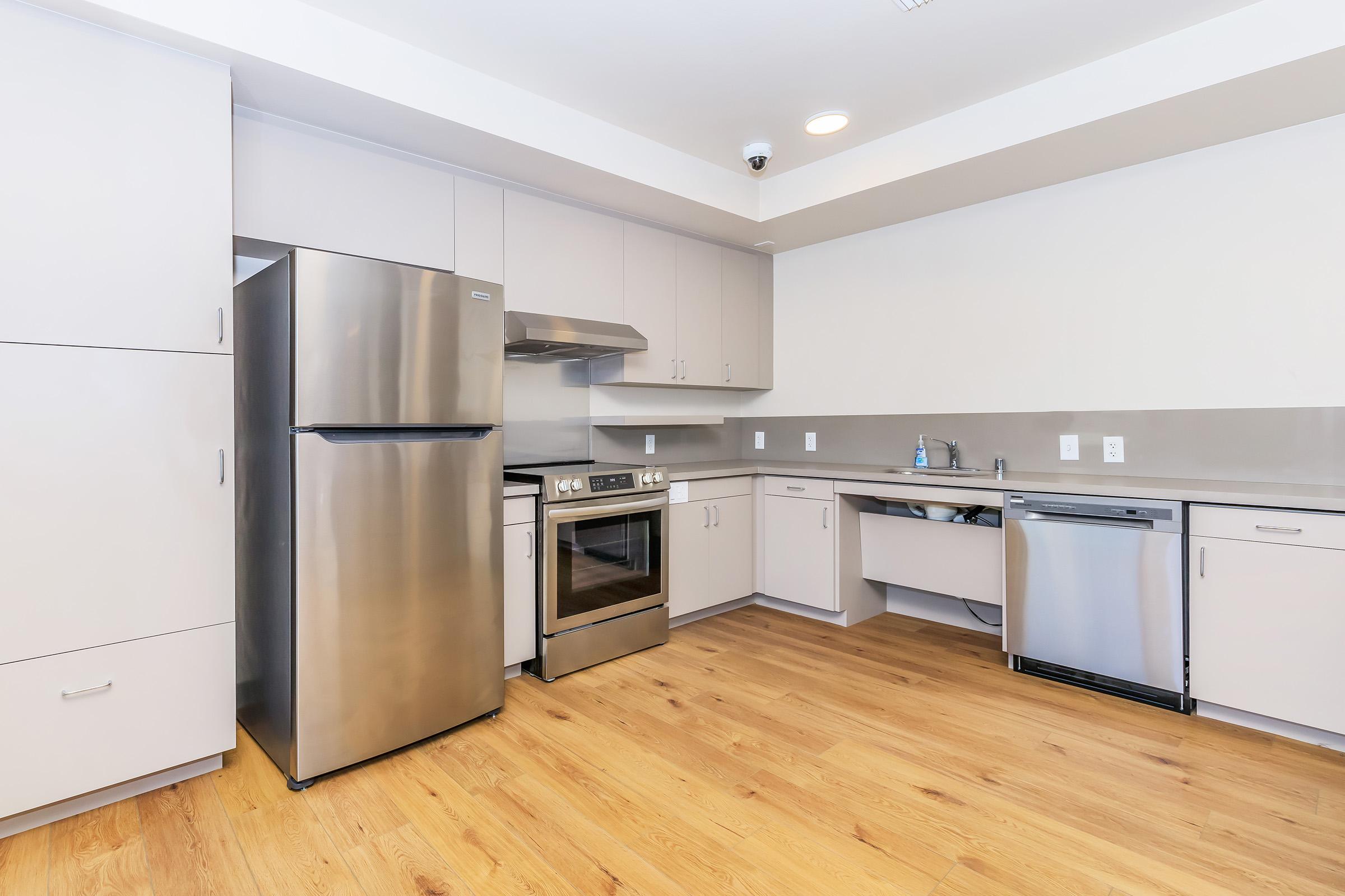 a stainless steel refrigerator in a kitchen